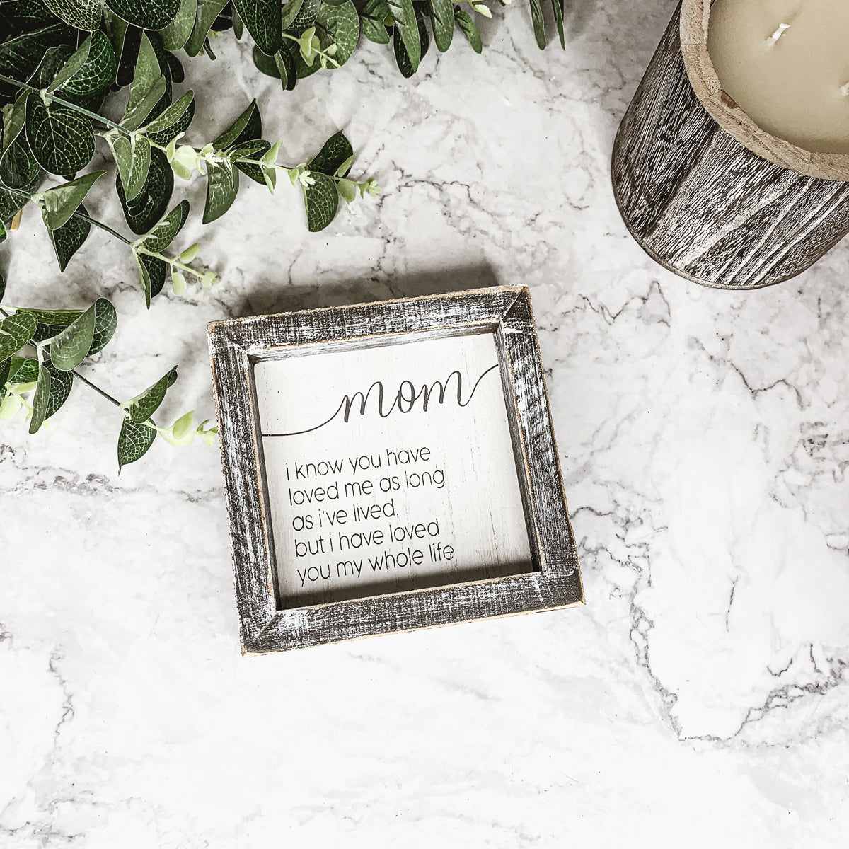 A rustic wooden framed sign measuring 5x5 inches with a heartfelt quote for mothers, perfect for home decor.