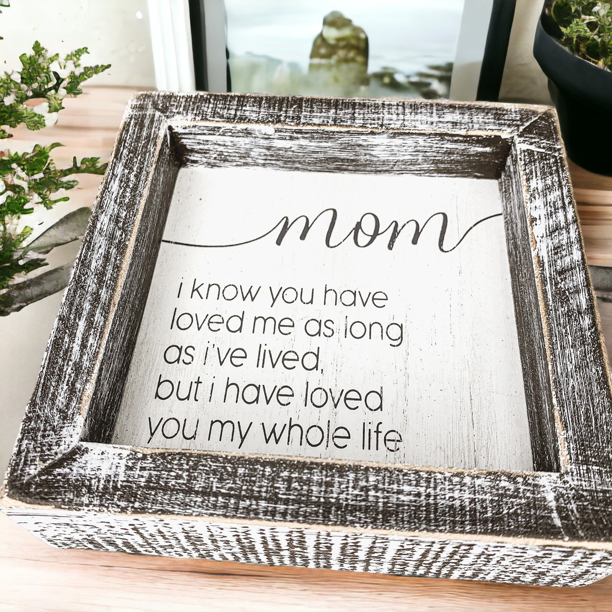 A rustic wooden framed sign measuring 5x5 inches with a heartfelt quote for mothers, perfect for home decor.