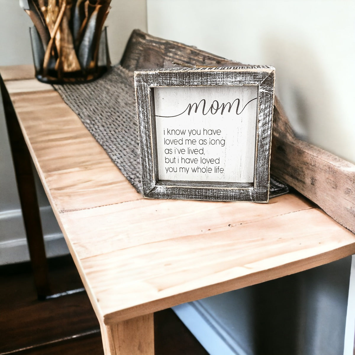 A rustic wooden framed sign measuring 5x5 inches with a heartfelt quote for mothers, perfect for home decor.