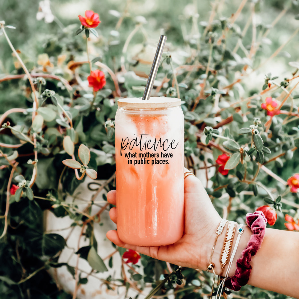 Patience in Public Set featuring a glass cup with bamboo lid, stainless steel straws, and a straw cleaner, showcasing its elegant design and functionality.