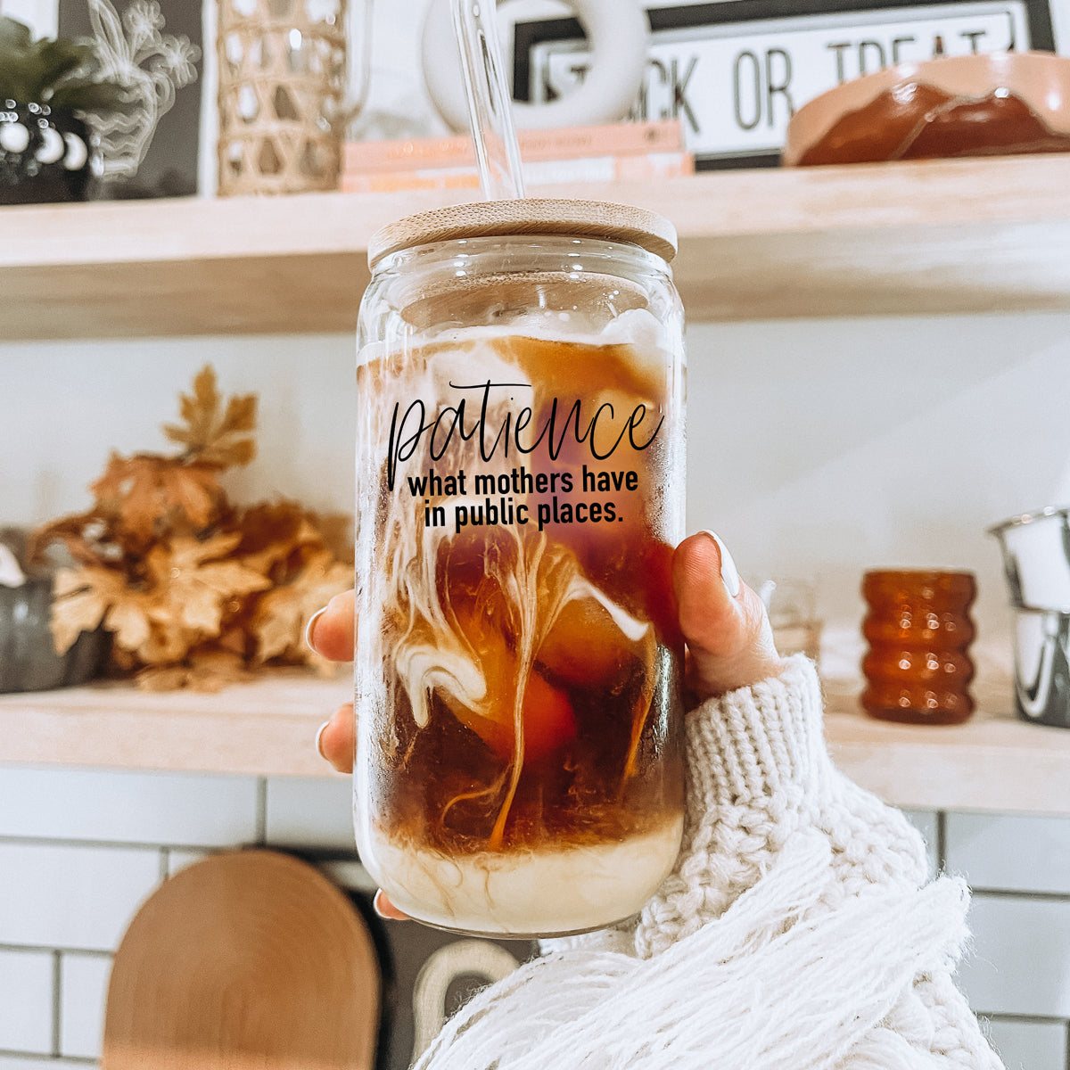 Patience in Public Set featuring a glass cup with bamboo lid, stainless steel straws, and a straw cleaner, showcasing its elegant design and functionality.