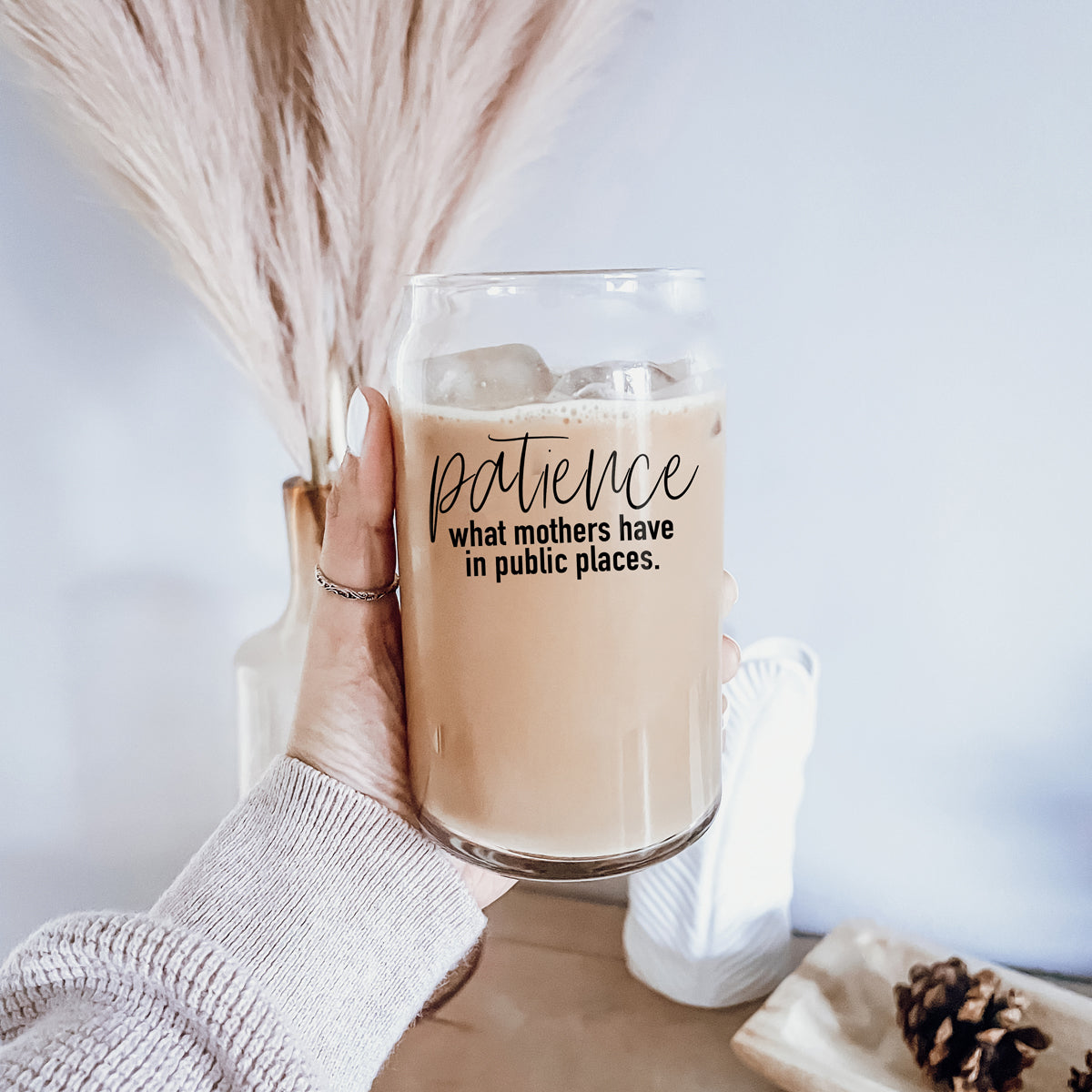 Patience in Public Set featuring a glass cup with bamboo lid, stainless steel straws, and a straw cleaner, showcasing its elegant design and functionality.