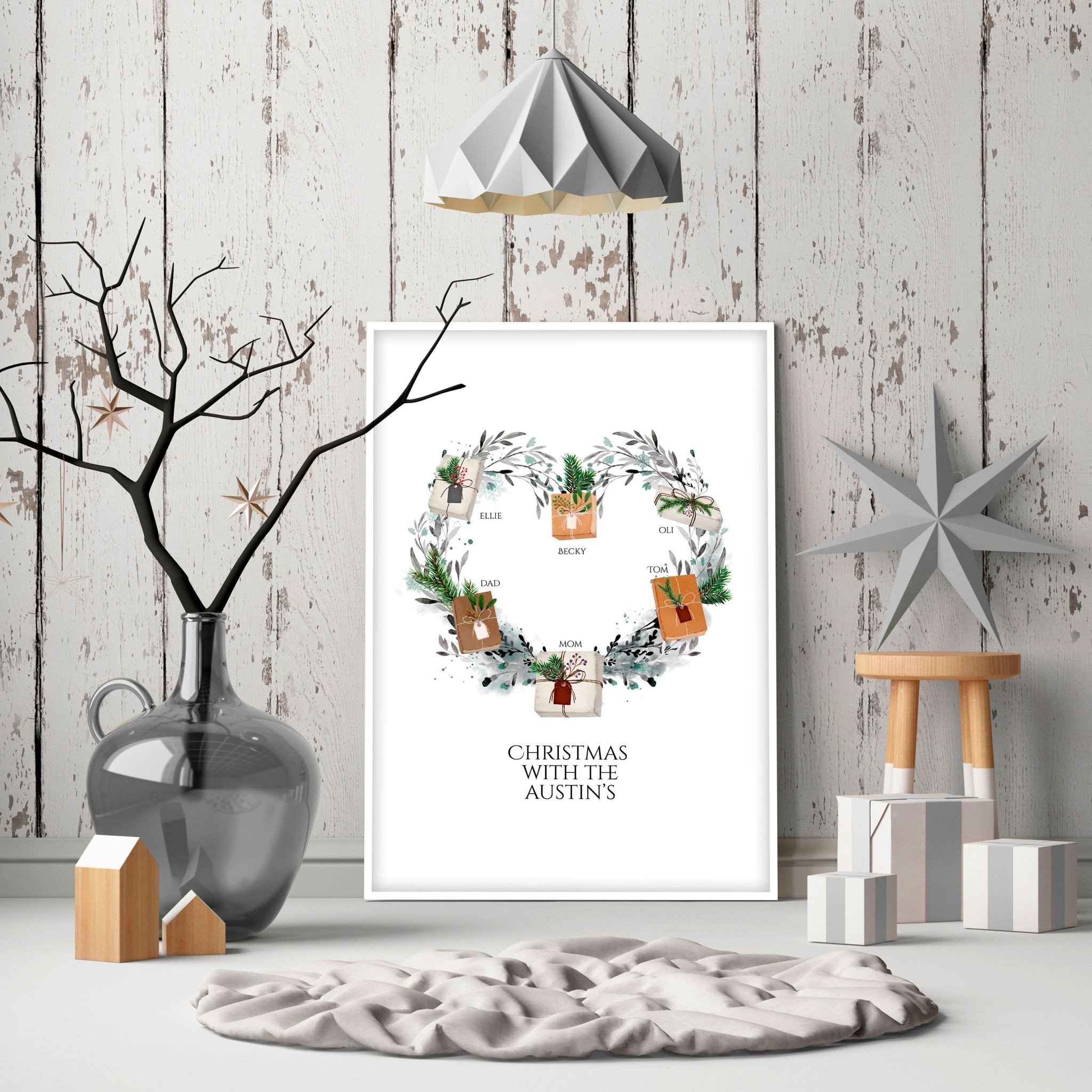 Personalized family wall art featuring a watercolour wreath with gift boxes, customizable with family names and a quote.