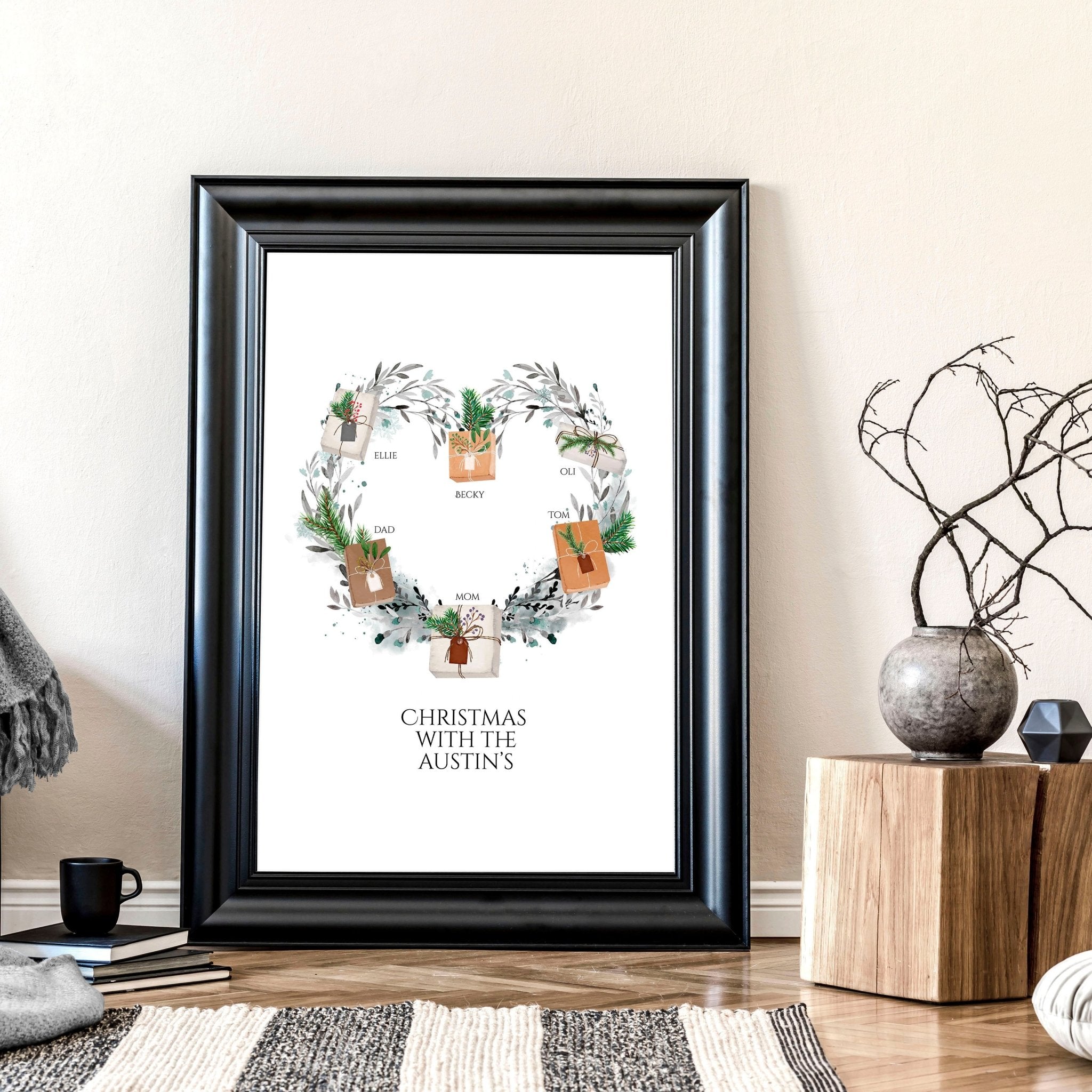 Personalized family wall art featuring a watercolour wreath with gift boxes, customizable with family names and a quote.