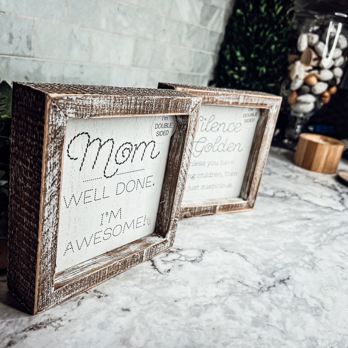 Double-sided 6-inch sign featuring humorous motherhood quotes, one side says 'I'm Awesome!' and the other 'Silence is Golden. Unless you have children, then it's just suspicious.'