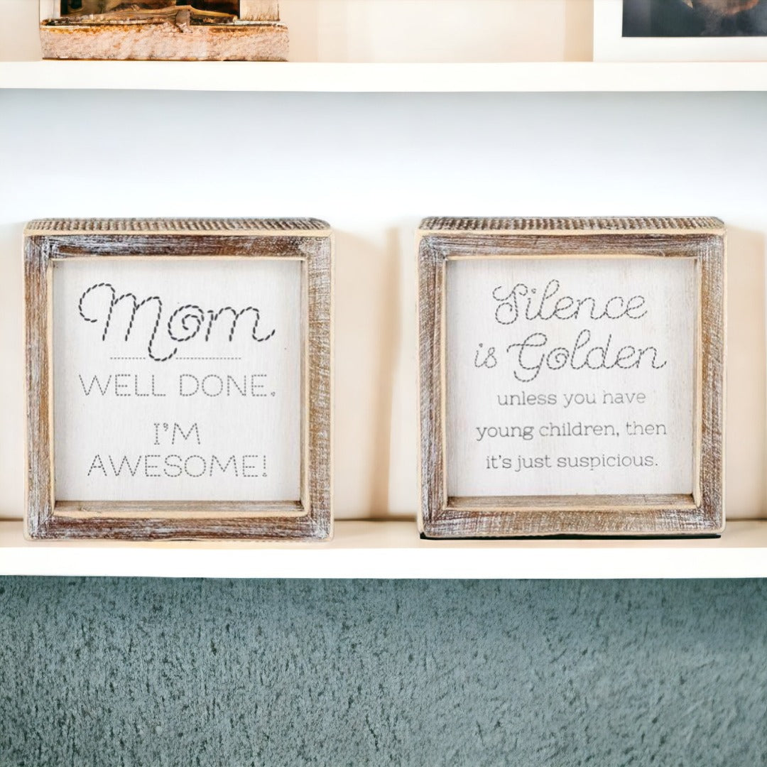 Double-sided 6-inch sign featuring humorous motherhood quotes, one side says 'I'm Awesome!' and the other 'Silence is Golden. Unless you have children, then it's just suspicious.'