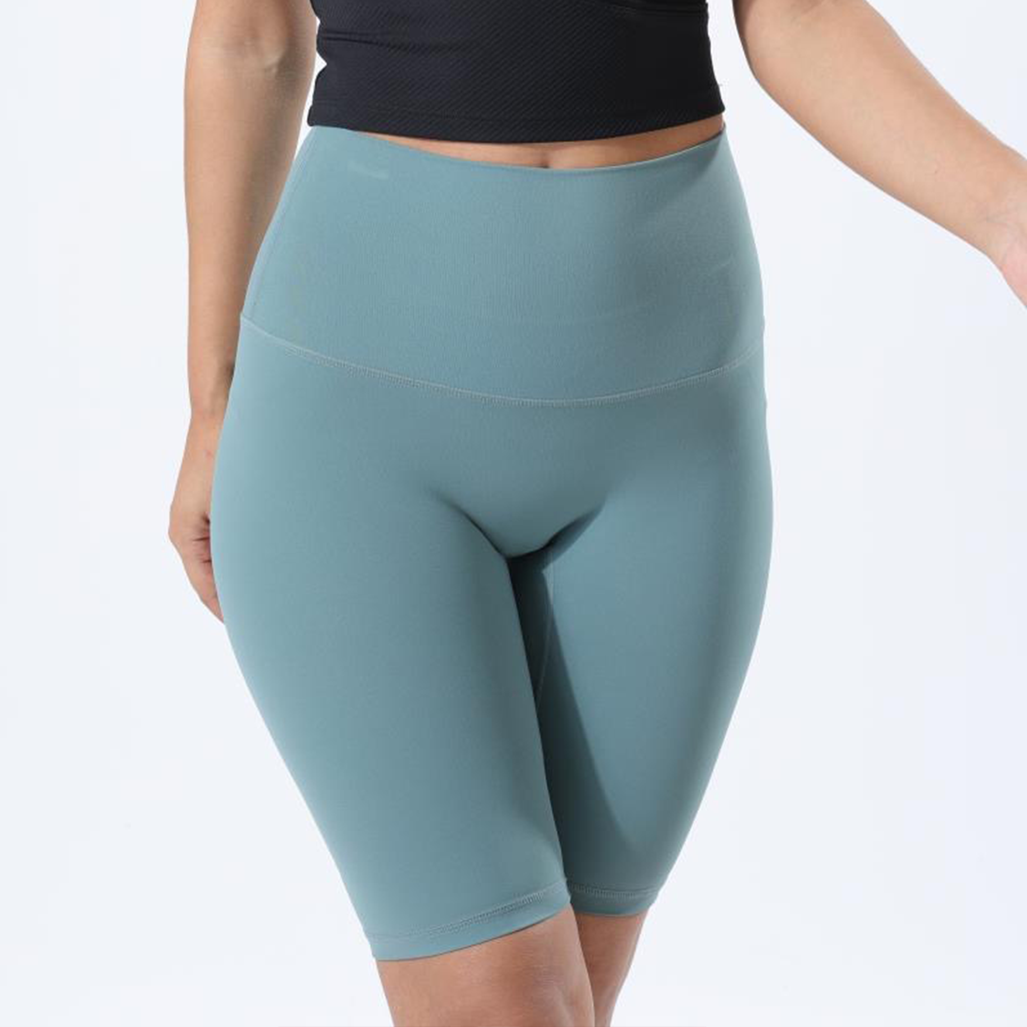 HauteD DK Bike Short in light green and deep green, featuring a long design and wide waistband for support.