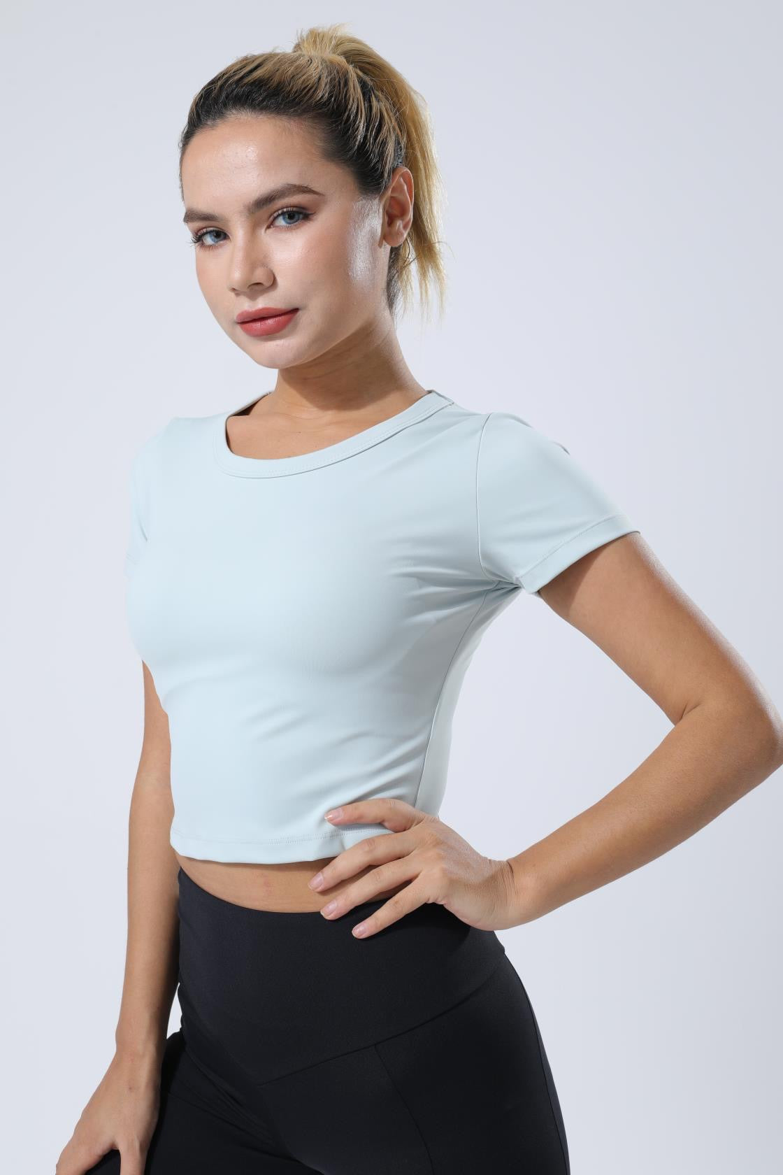 HauteD DK Crop Tee in a stylish design, showcasing its cropped length and soft fabric, perfect for summer wear.