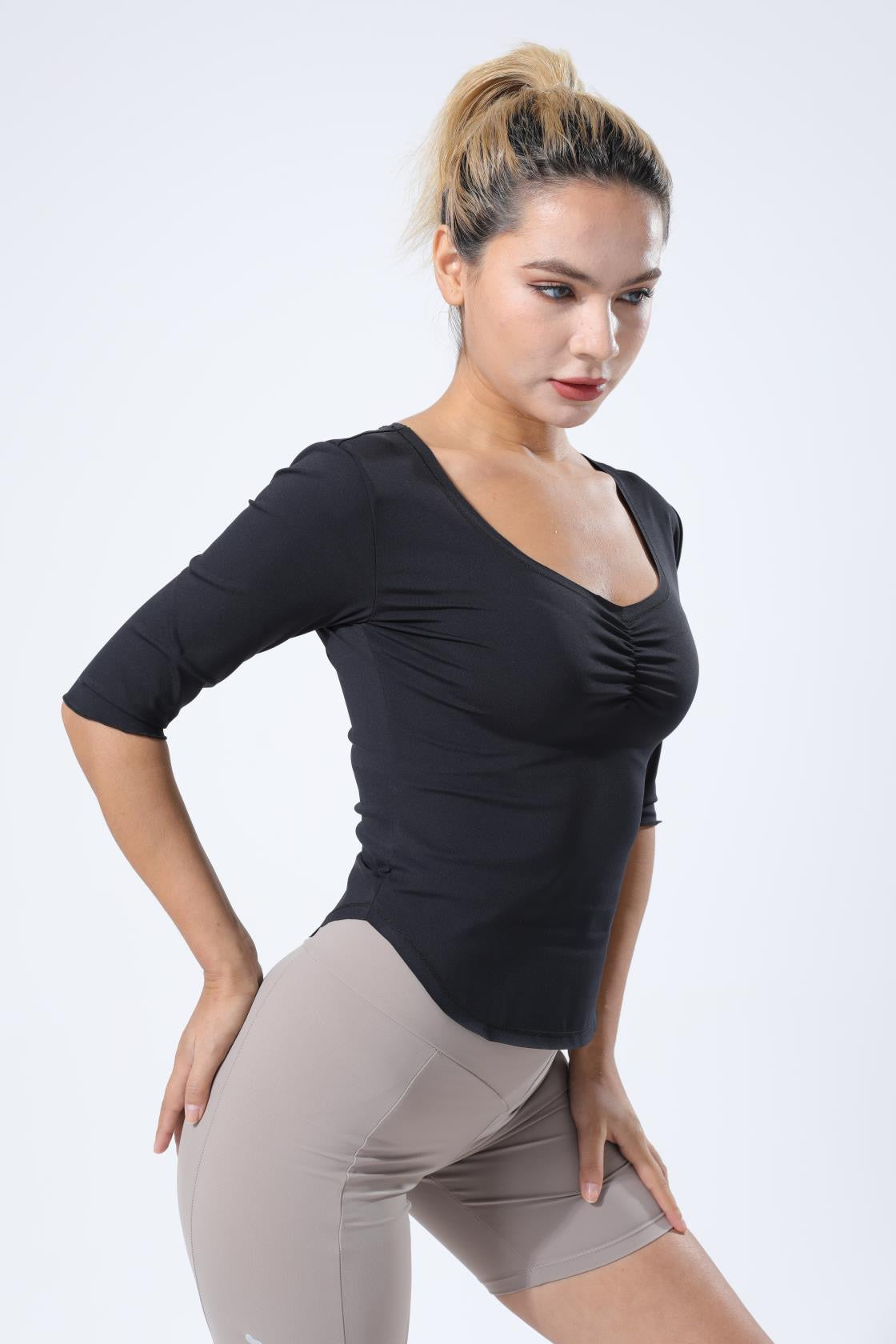 HauteD DK Deep V Tee featuring a stylish Deep V neckline and subtle ruffle cuffs, made from breathable 220 gram fabric.