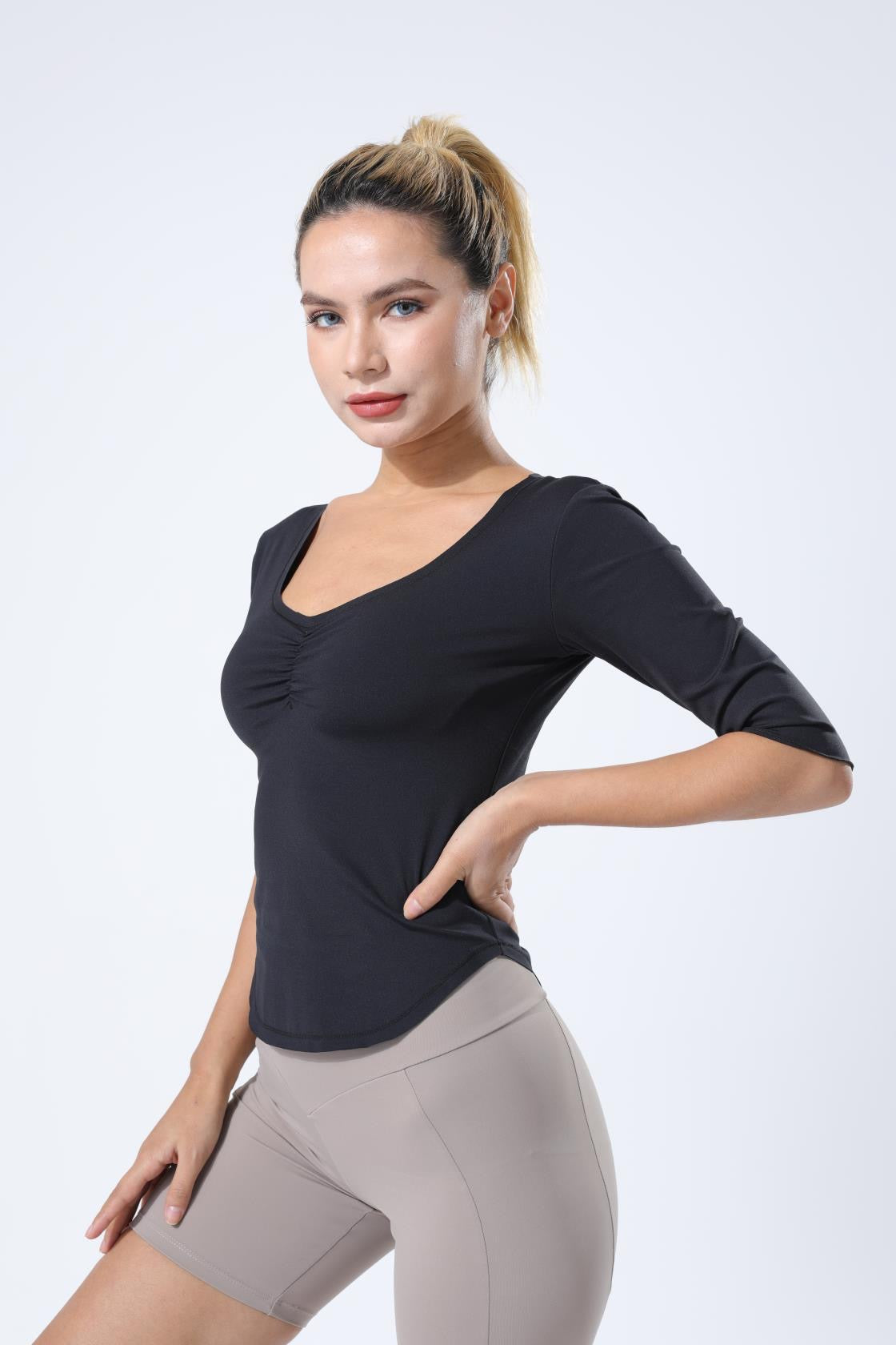 HauteD DK Deep V Tee featuring a stylish Deep V neckline and subtle ruffle cuffs, made from breathable 220 gram fabric.