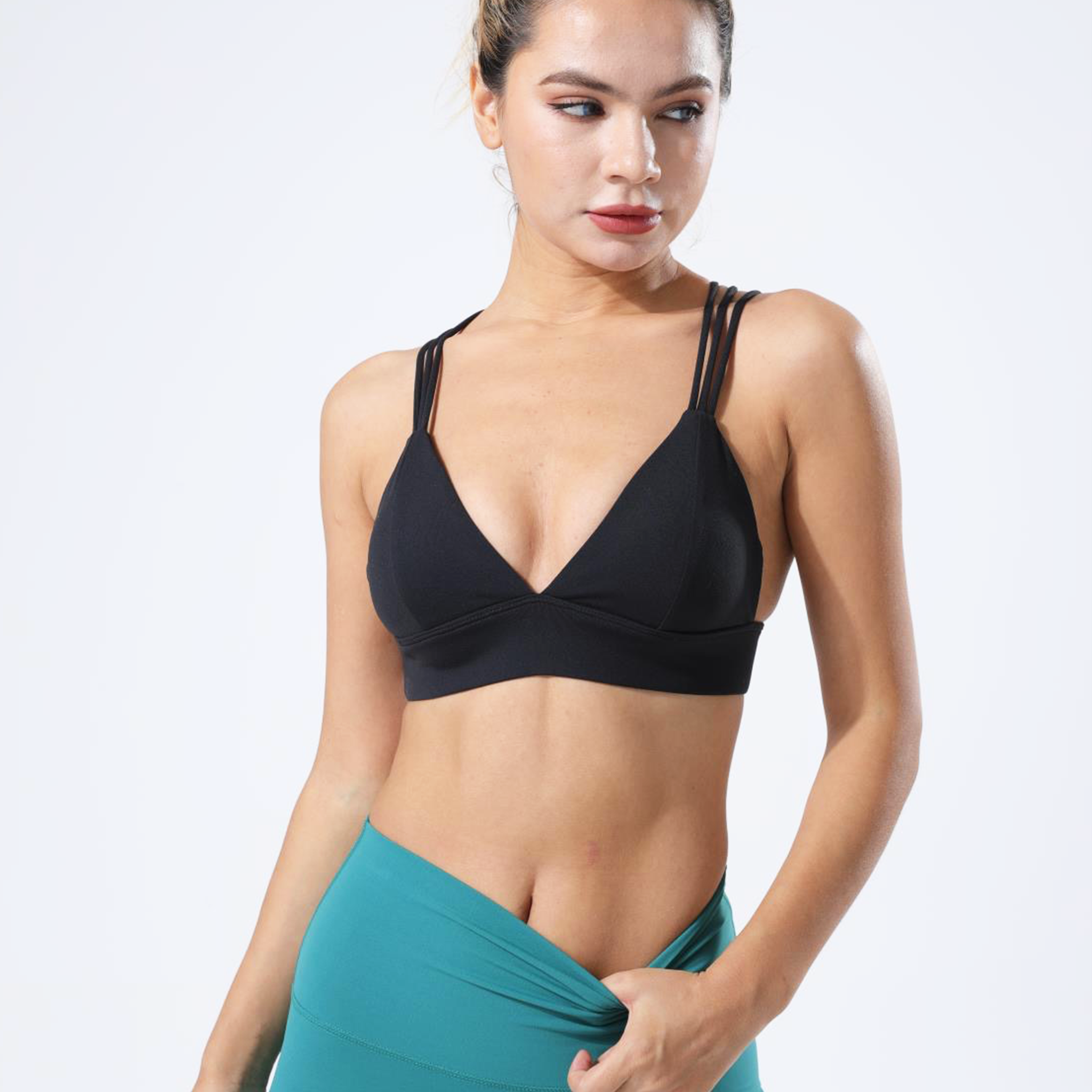 HauteD DK Triple Cross Sports Bra featuring elegant triple straps and luxurious fabric blend.