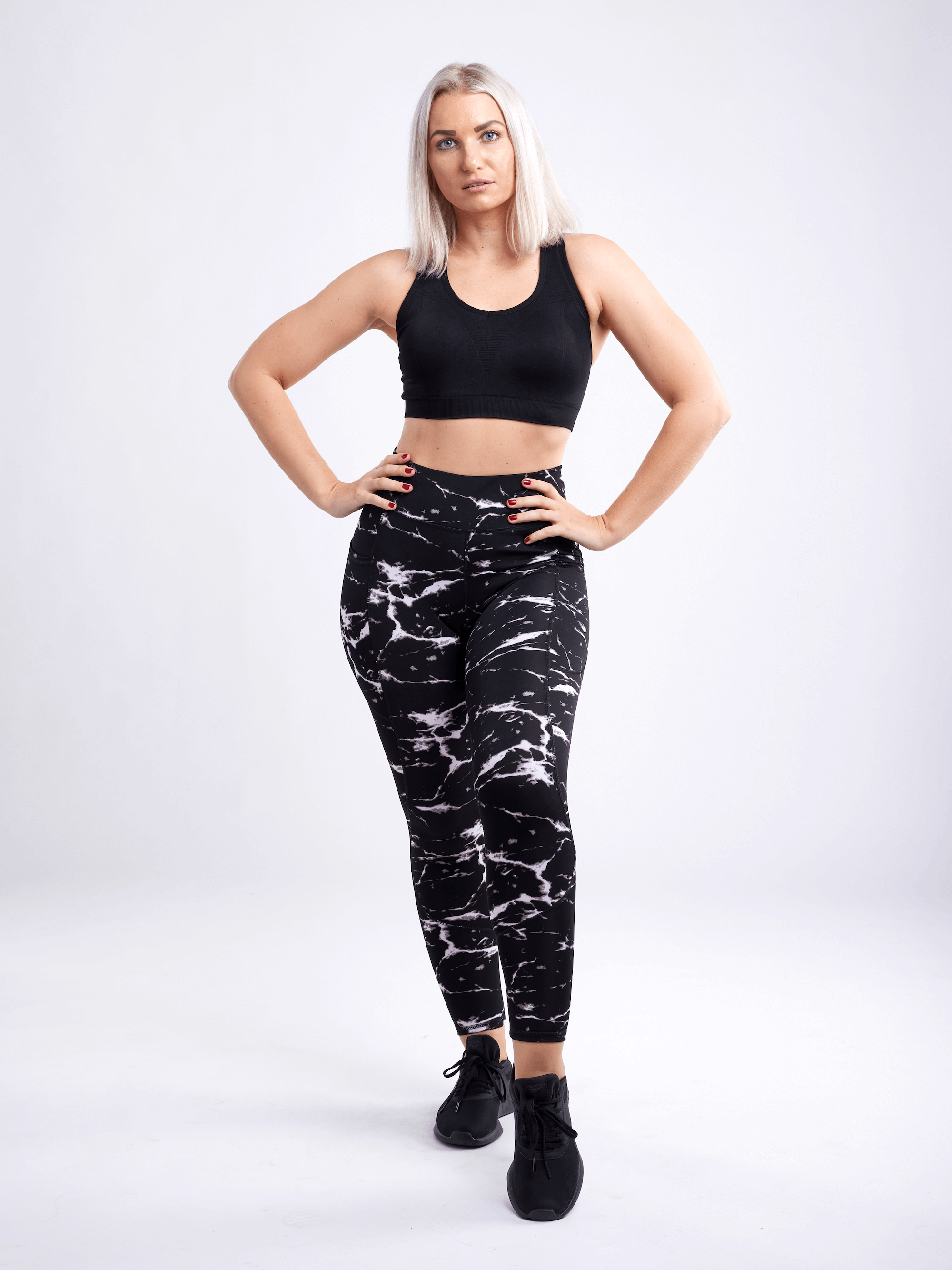 High-Waisted Classic Gym Leggings with Side Pockets for Women, featuring a smooth fabric, high waistband, and large side pockets for essentials.