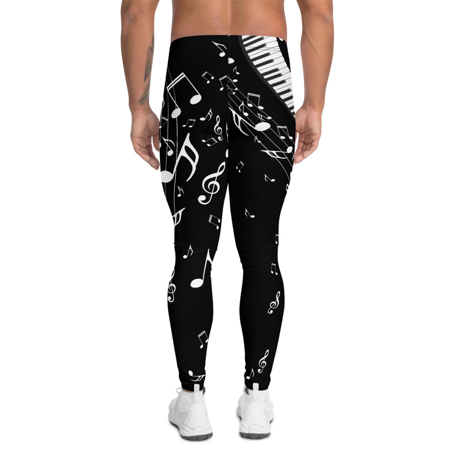 A pair of black leggings for men featuring a stylish music notes print, designed for comfort and performance during various activities.