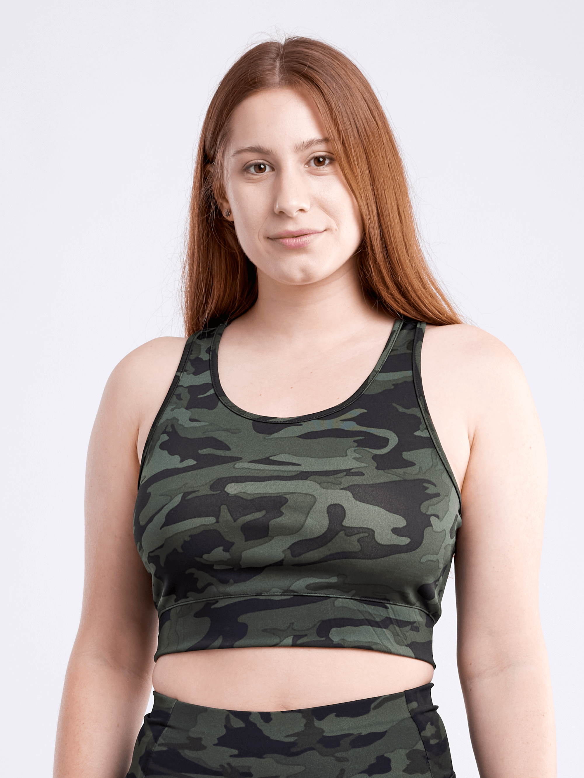 A lightweight women's racerback crop tank top in a stylish design, perfect for workouts and casual wear, showcasing its breathable fabric and seamless construction.