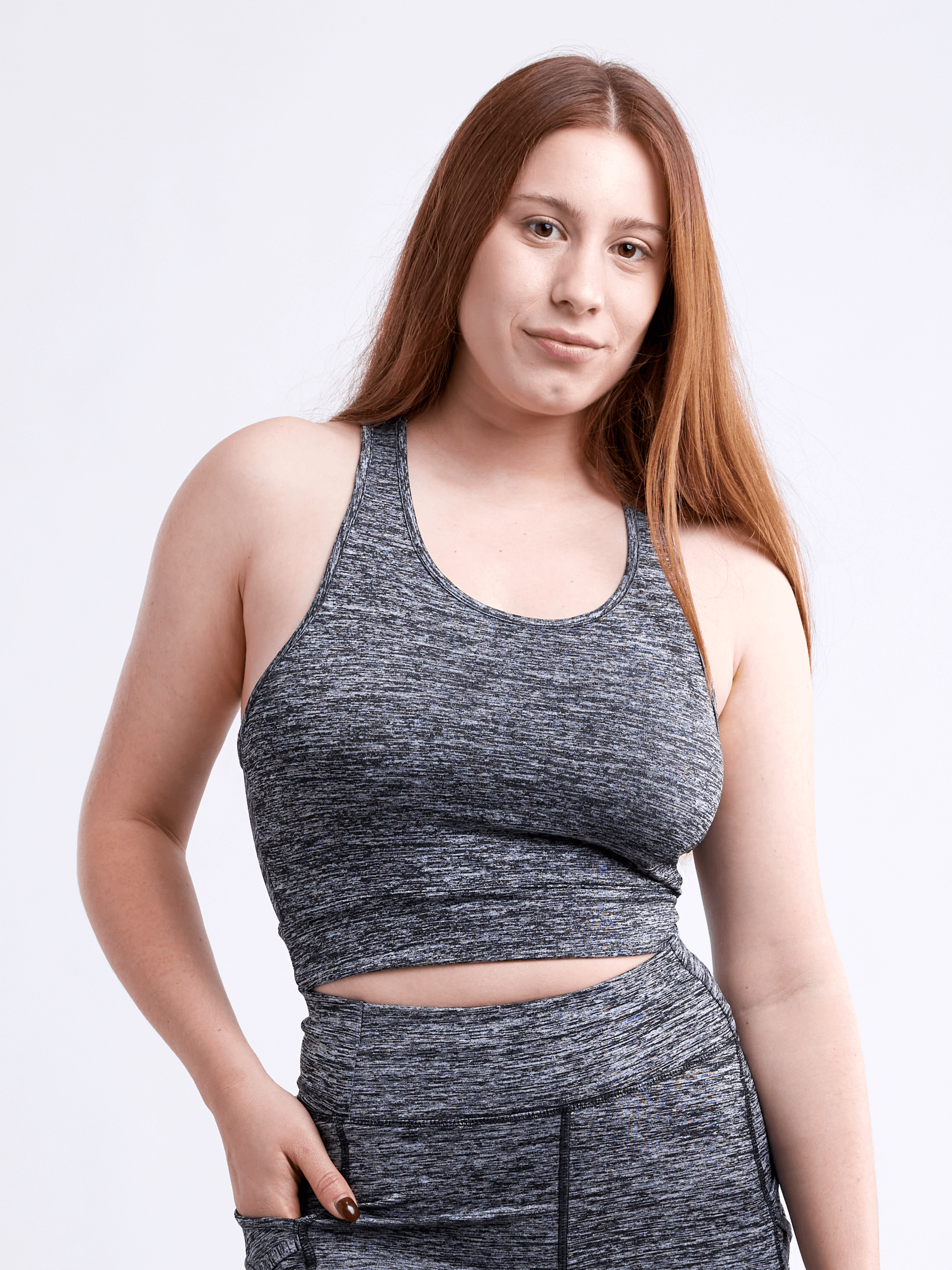 A lightweight women's racerback crop tank top in a stylish design, perfect for workouts and casual wear, showcasing its breathable fabric and seamless construction.