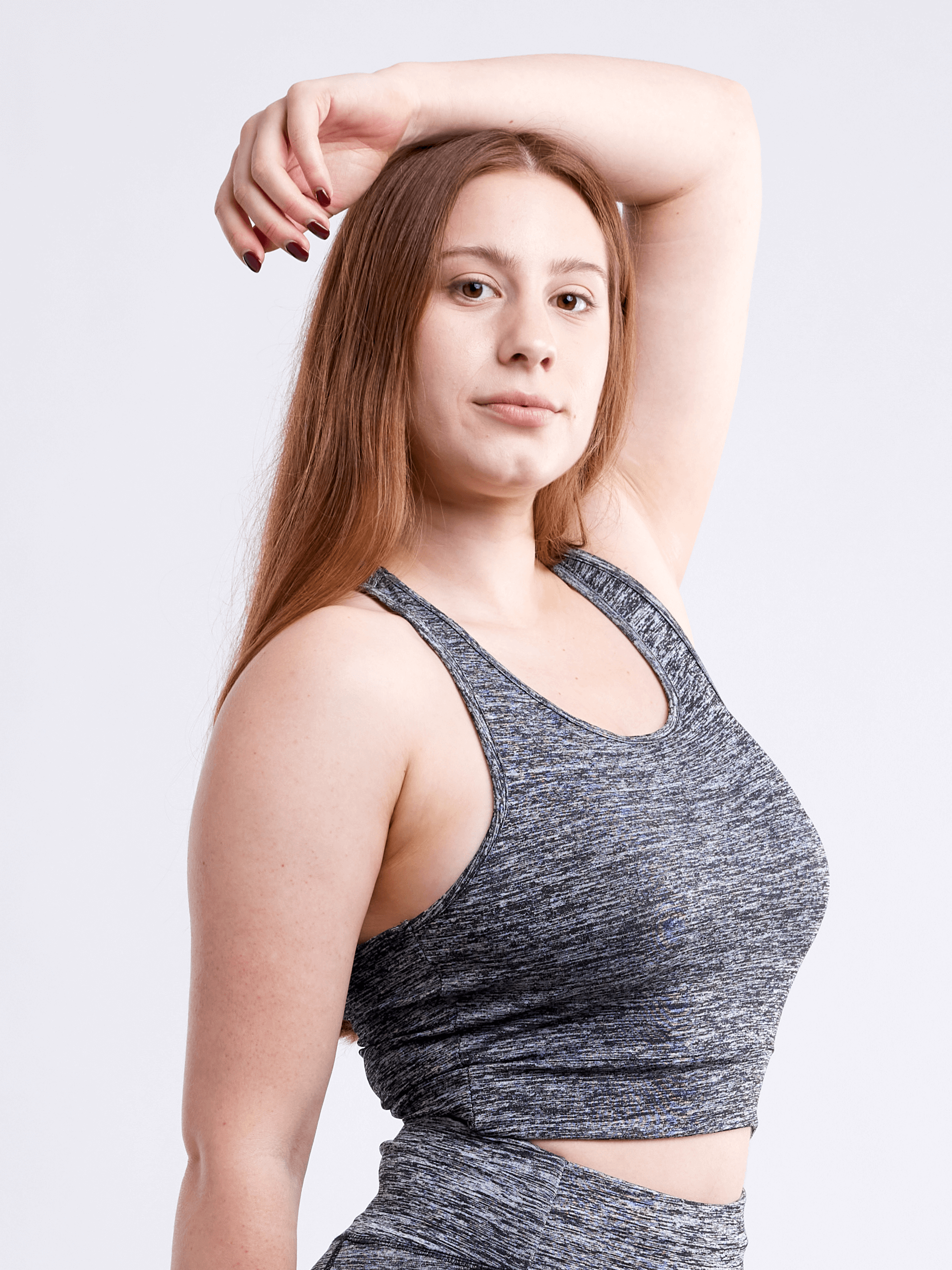 A lightweight women's racerback crop tank top in a stylish design, perfect for workouts and casual wear, showcasing its breathable fabric and seamless construction.