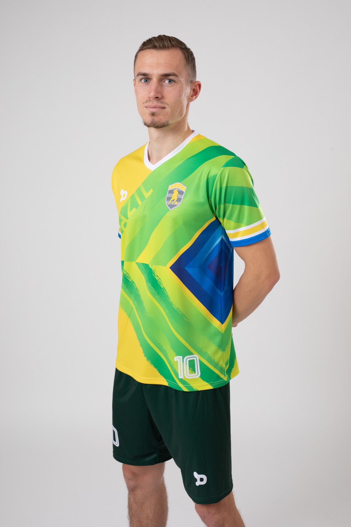 Ronaldinho Brazil Jersey replica featuring V-Neck design and sublimated silhouette badge.