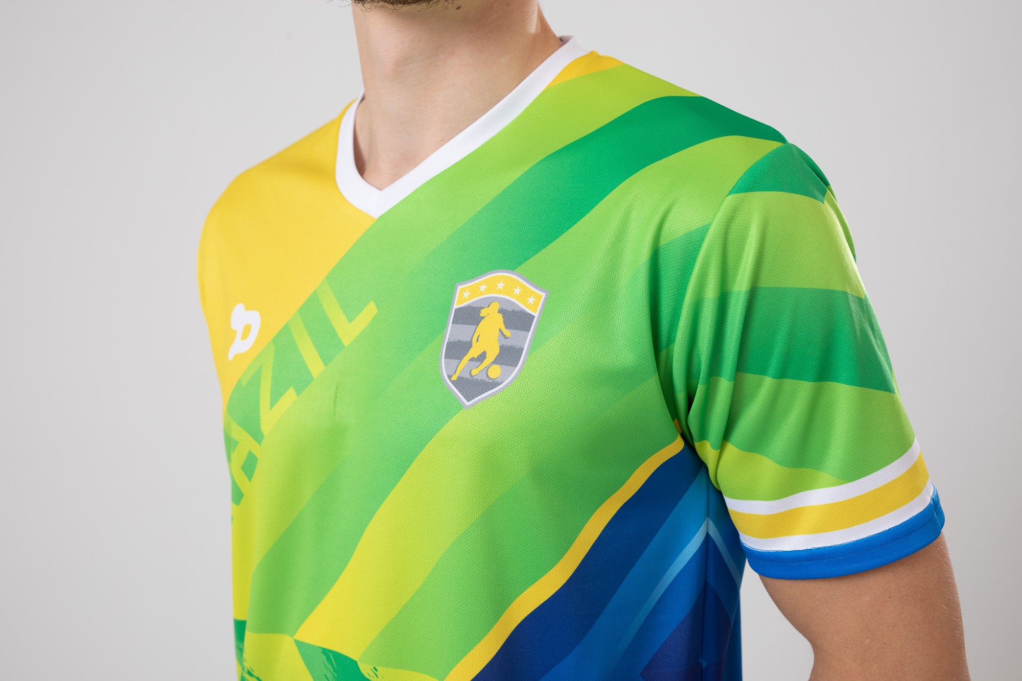 Ronaldinho Brazil Jersey replica featuring V-Neck design and sublimated silhouette badge.