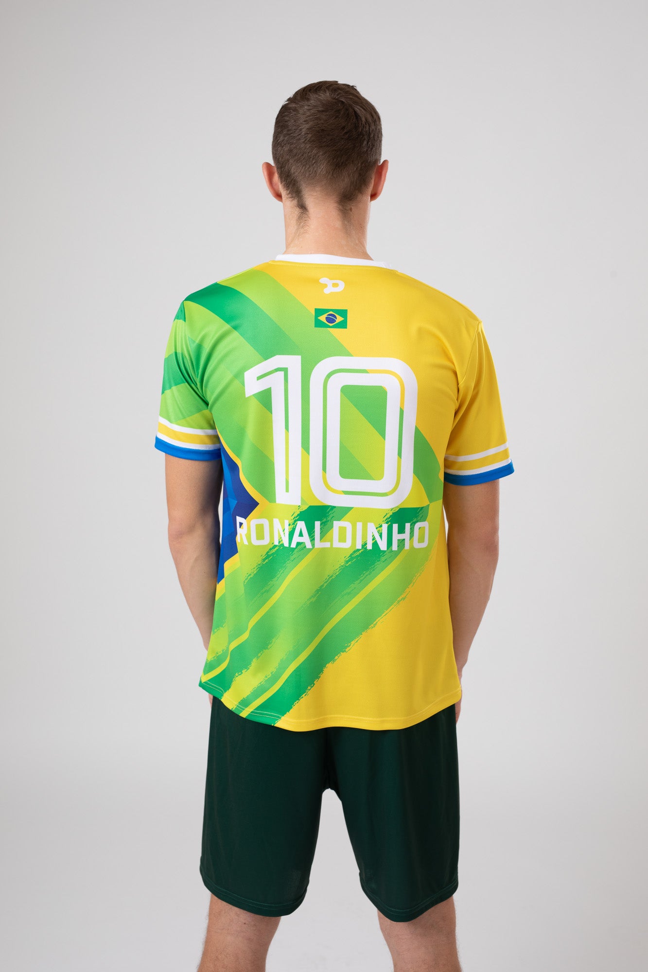 Ronaldinho Brazil Jersey replica featuring V-Neck design and sublimated silhouette badge.