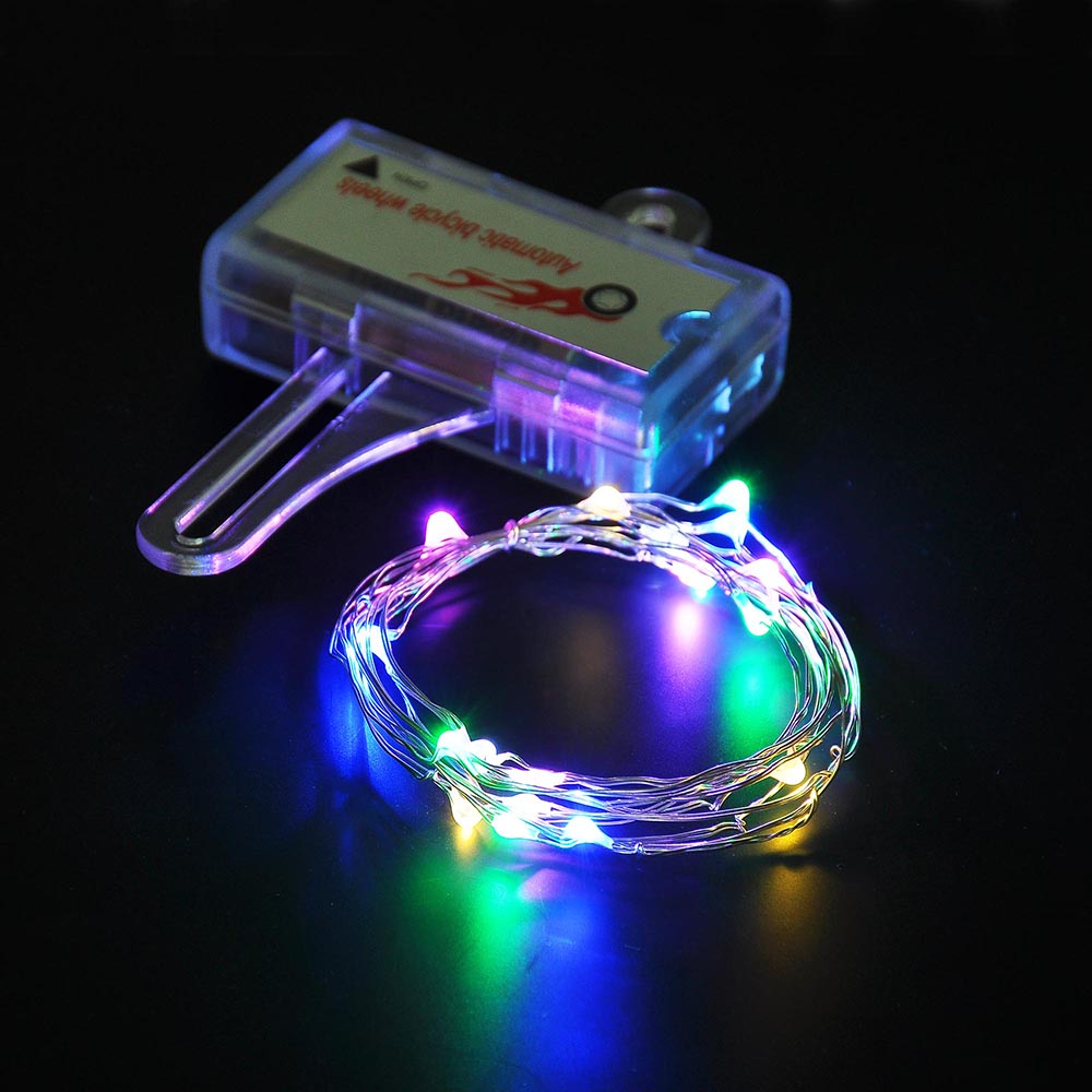 Colorful Mini LED Bike Wheel Spoke Light attached to a bicycle wheel, illuminating with vibrant colors for enhanced visibility during night rides.