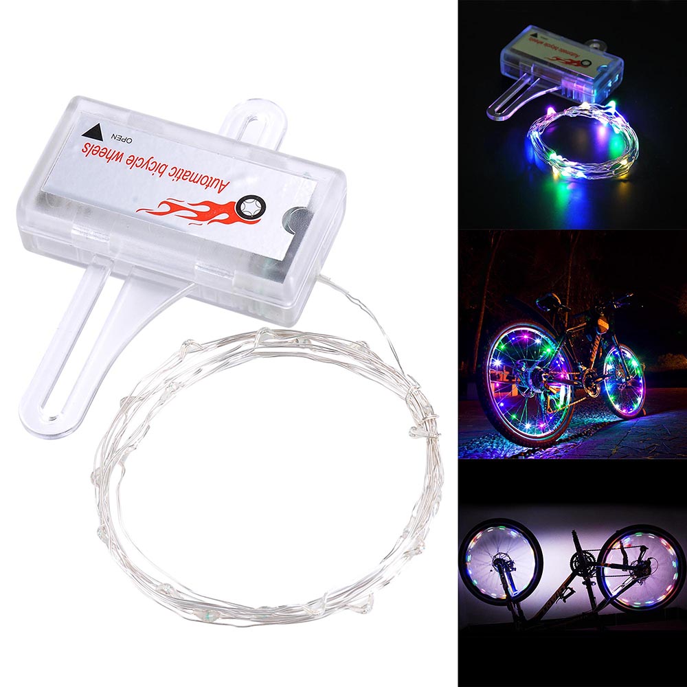 Colorful Mini LED Bike Wheel Spoke Light attached to a bicycle wheel, illuminating with vibrant colors for enhanced visibility during night rides.