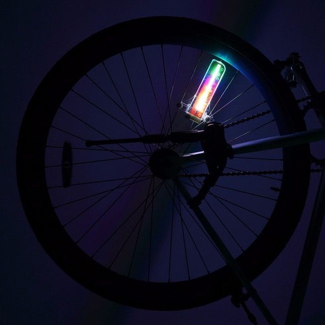 Bicycle Lights Bike Cycling Wheel Spoke Light 32 featuring 32 bright LED lights mounted on bicycle spokes, showcasing a waterproof design for durability.