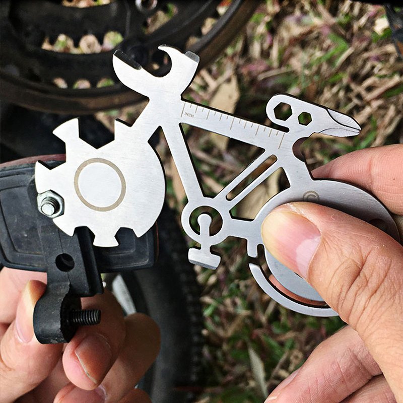 A compact Bicycle Multi Tool featuring various tools for bike repairs, showcasing its portable design and custom engraving option.