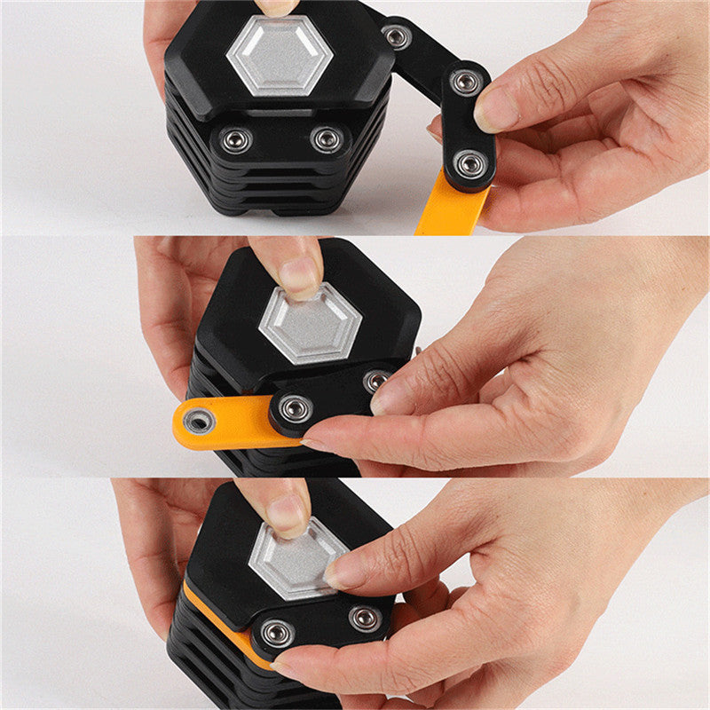 Foldable bike lock with three keys, showcasing its durable steel construction and compact design for easy portability.