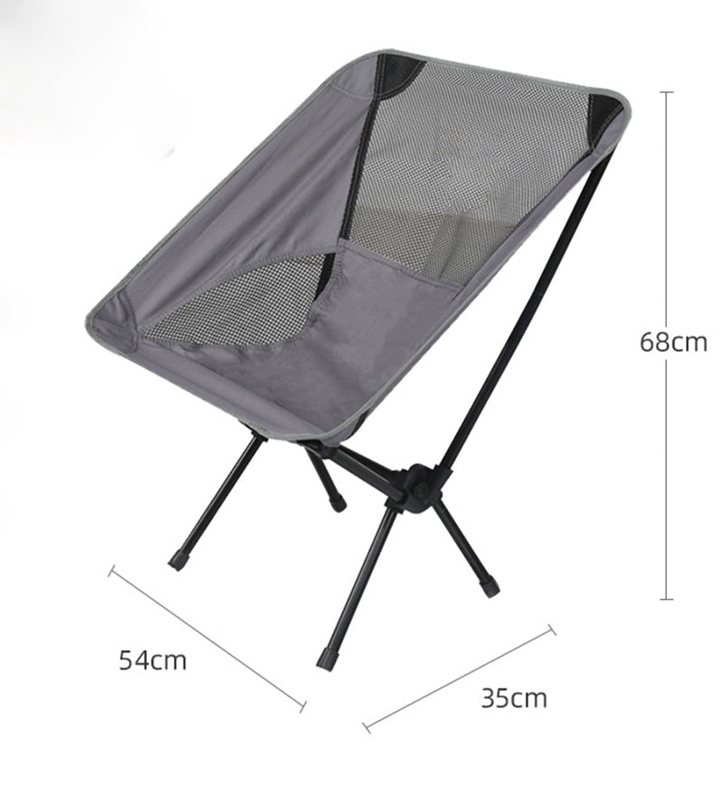 Ultralight Outdoor Folding Camping Chair in a natural setting, showcasing its lightweight design and durable fabric.