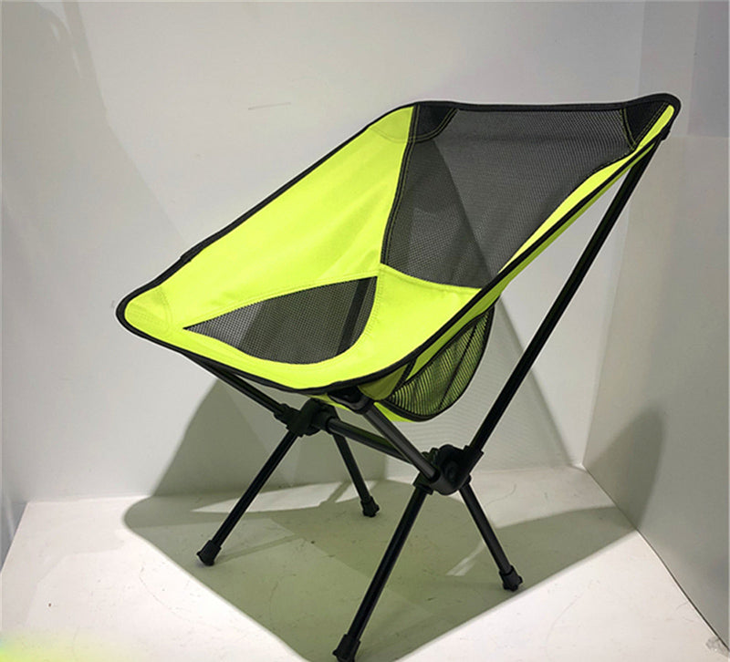 Ultralight Outdoor Folding Camping Chair in a natural setting, showcasing its lightweight design and durable fabric.