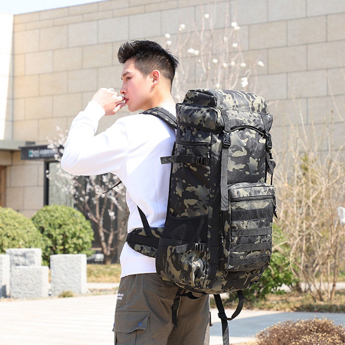 A large 70L waterproof military backpack designed for outdoor camping and hiking, featuring durable 600D Oxford cloth and ergonomic padded straps.