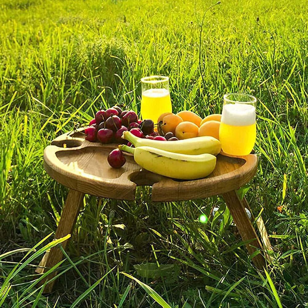 Wooden outdoor folding picnic table with glass holder, showcasing its modern design and functionality for outdoor dining.