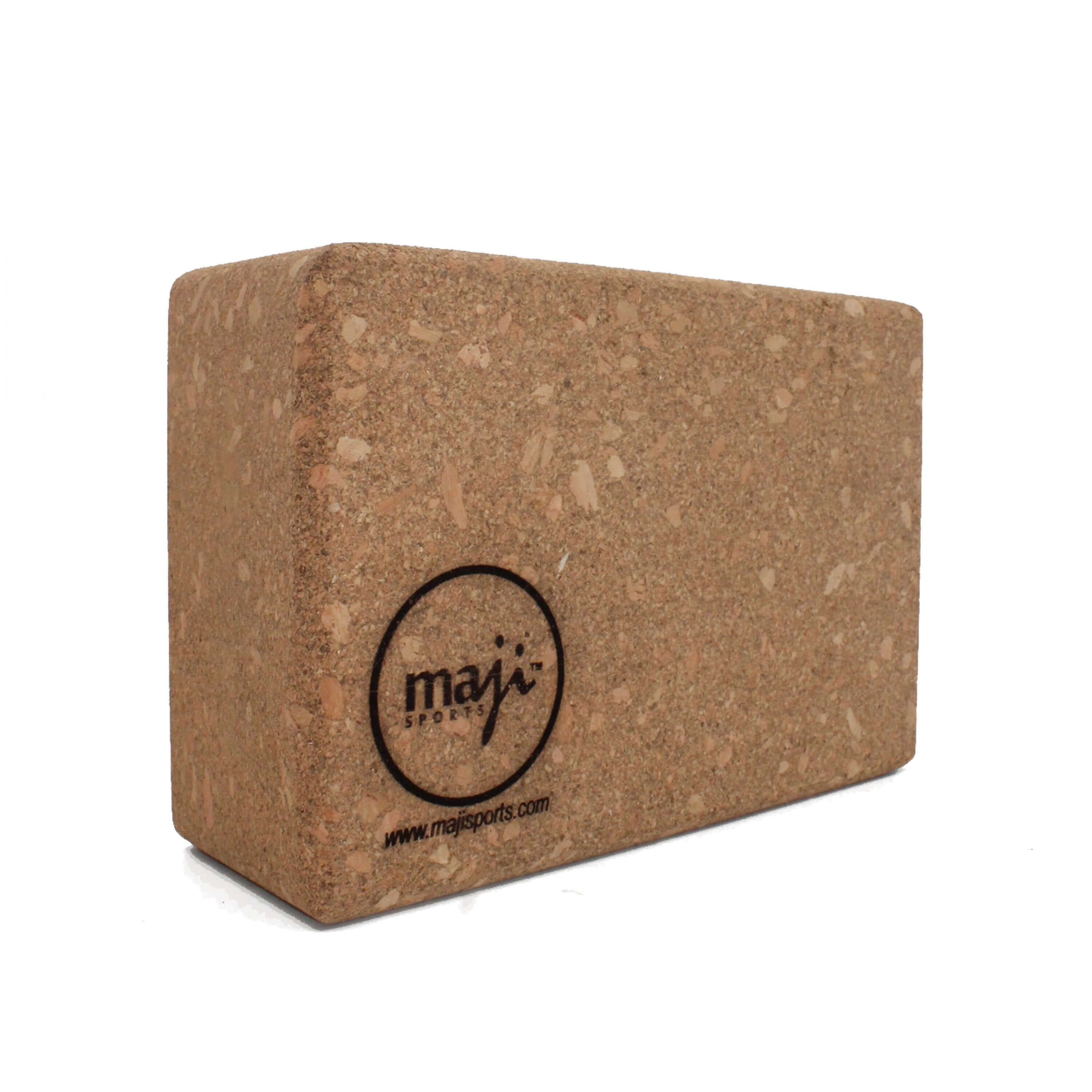 A 100% cork yoga and pilates block with round edges, showcasing its lightweight design and eco-friendly material, perfect for enhancing yoga practice.