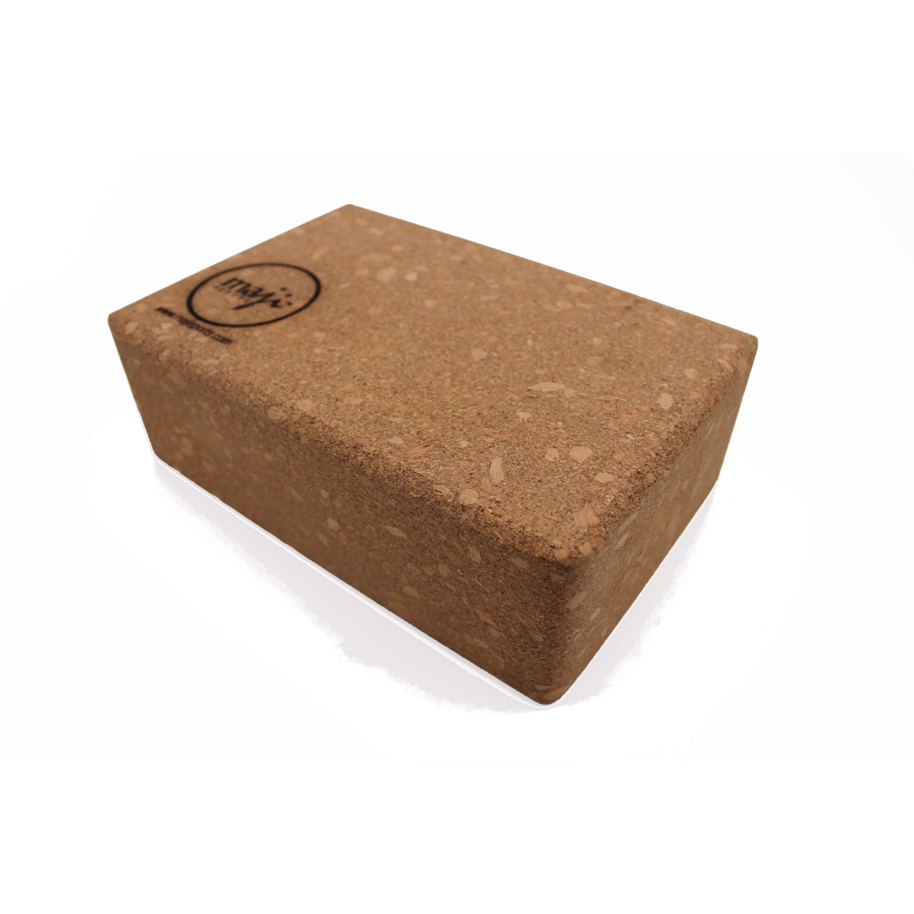 A 100% cork yoga and pilates block with round edges, showcasing its lightweight design and eco-friendly material, perfect for enhancing yoga practice.