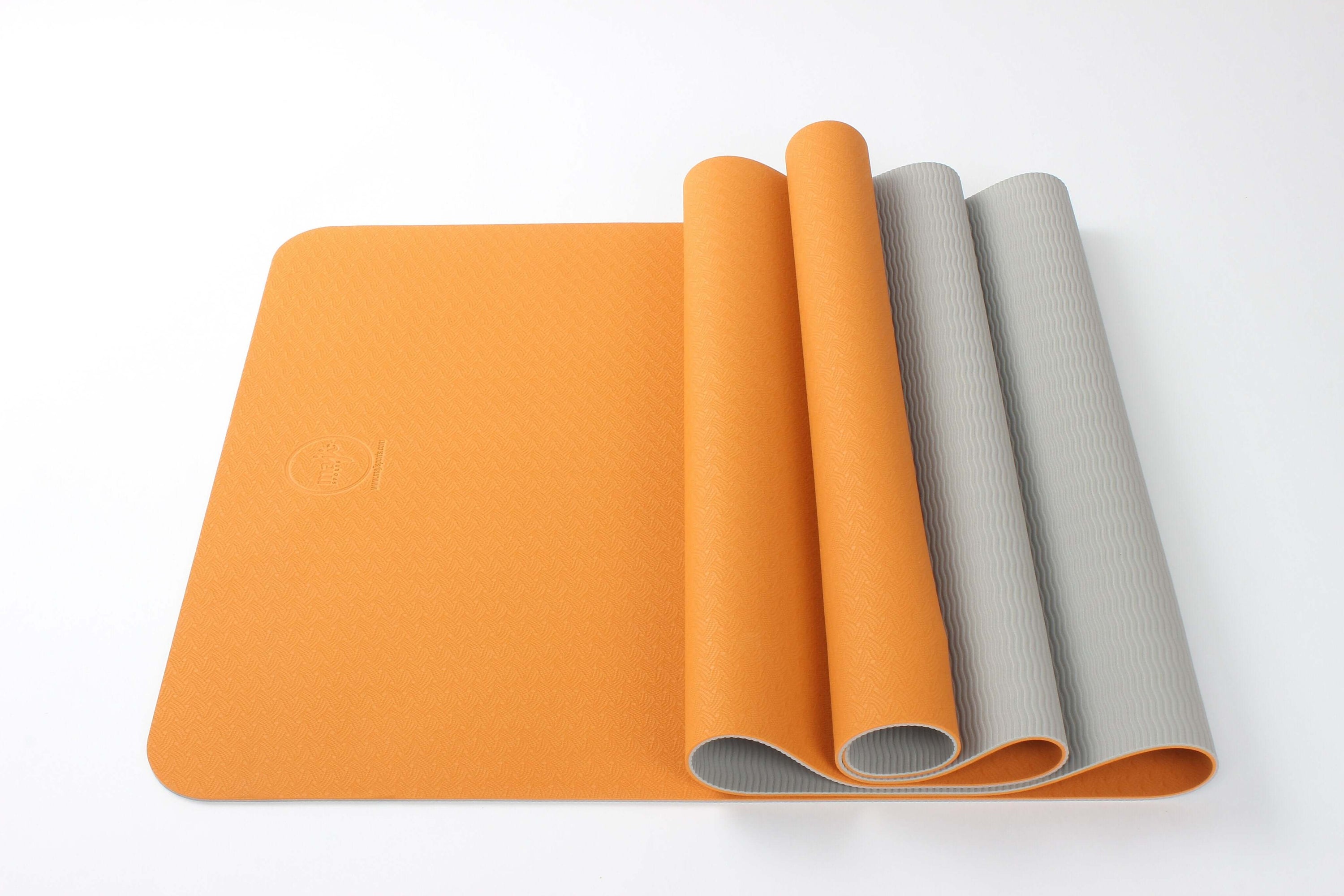 2-Tone TPE Premium Yoga Mat featuring an embossed pattern in vibrant colors, ideal for yoga and Pilates, showcasing its non-slip surface and eco-friendly material.