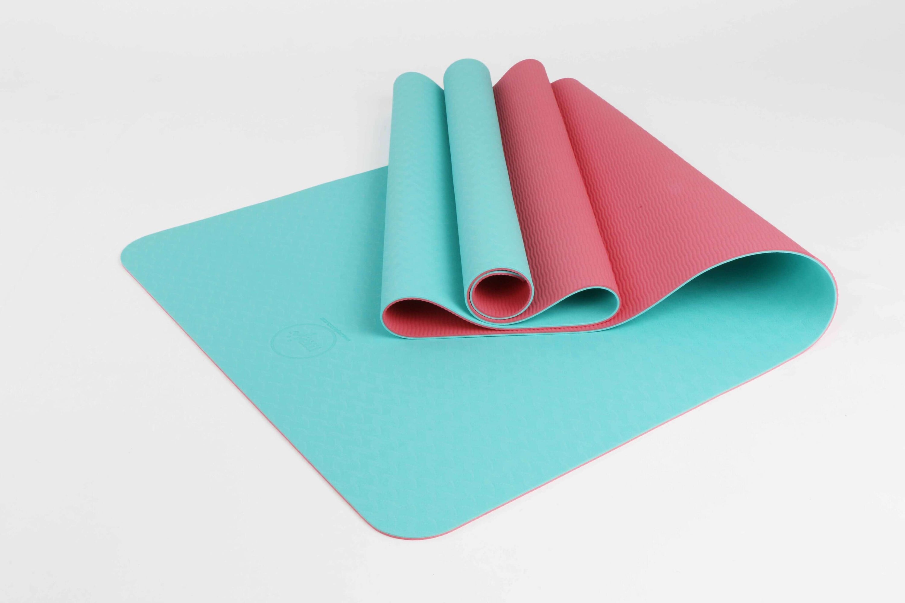 2-Tone TPE Premium Yoga Mat featuring an embossed pattern in vibrant colors, ideal for yoga and Pilates, showcasing its non-slip surface and eco-friendly material.