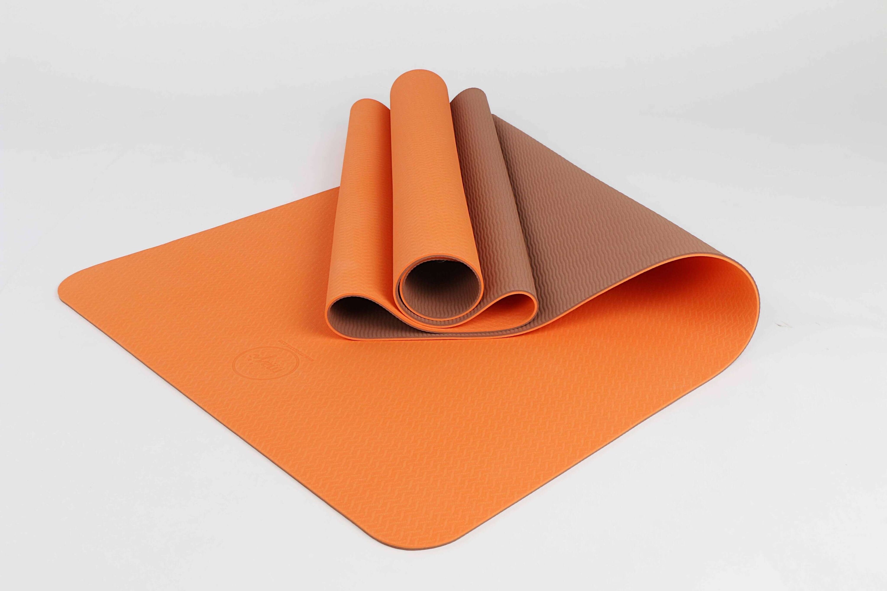 2-Tone TPE Premium Yoga Mat featuring an embossed pattern in vibrant colors, ideal for yoga and Pilates, showcasing its non-slip surface and eco-friendly material.