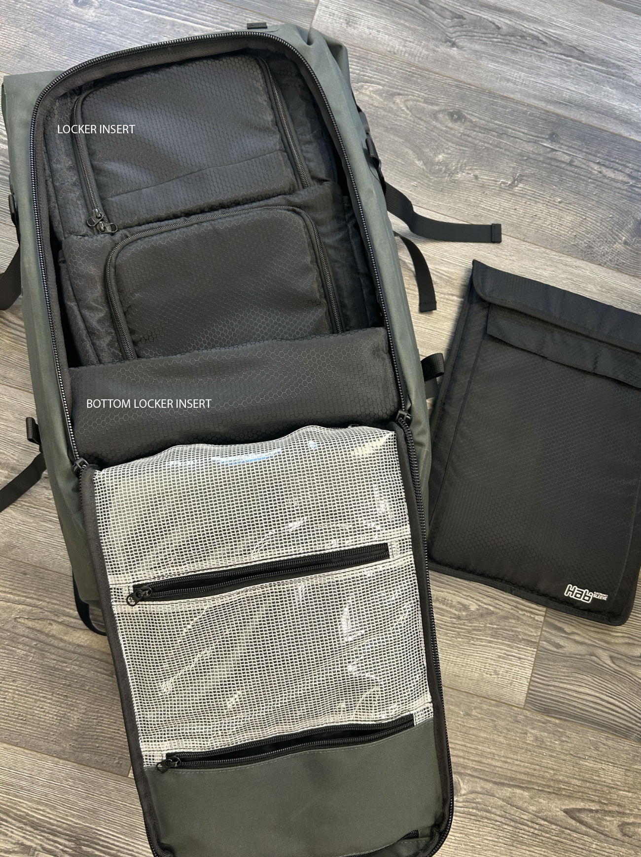 A waterproof and insulated 365 Backpack Cooler Insert by Hab Gear, designed to hold up to 18 cans, featuring snap attachments for secure fitting.