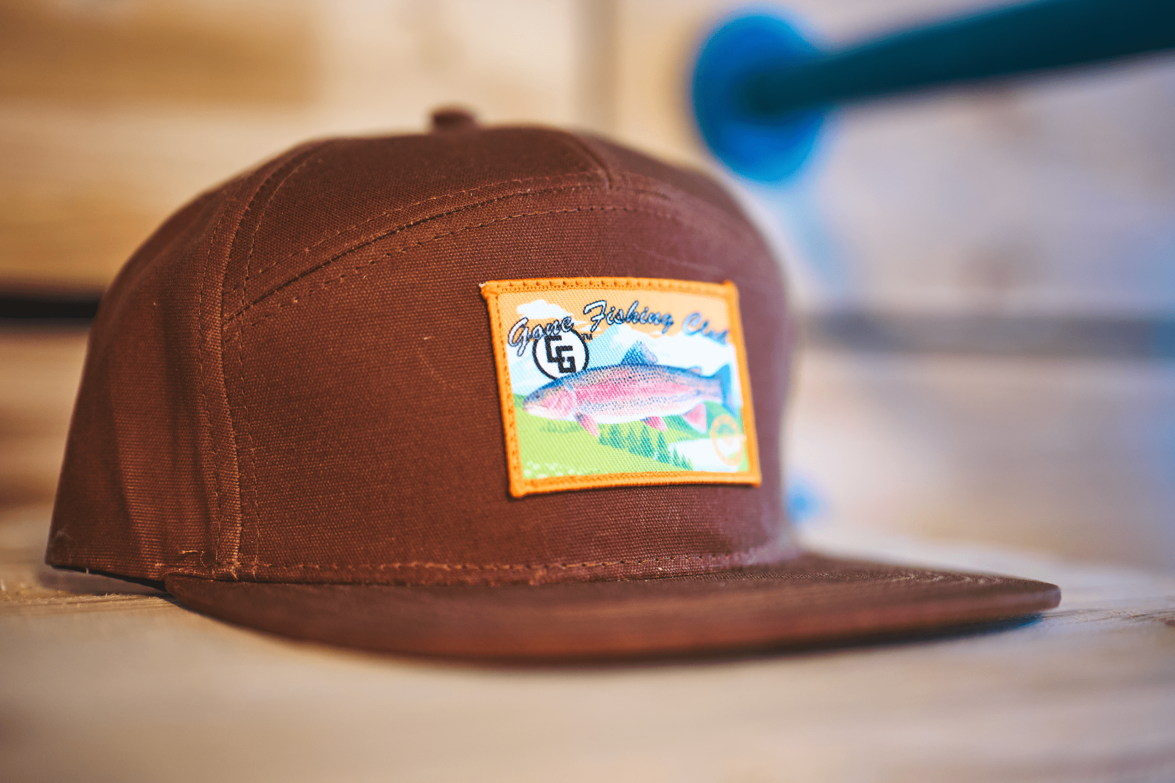 7 Panel Hat_Gone Fishing made of waxed cotton canvas with a custom patch and leather adjustable strap, showcasing a rugged and stylish design.