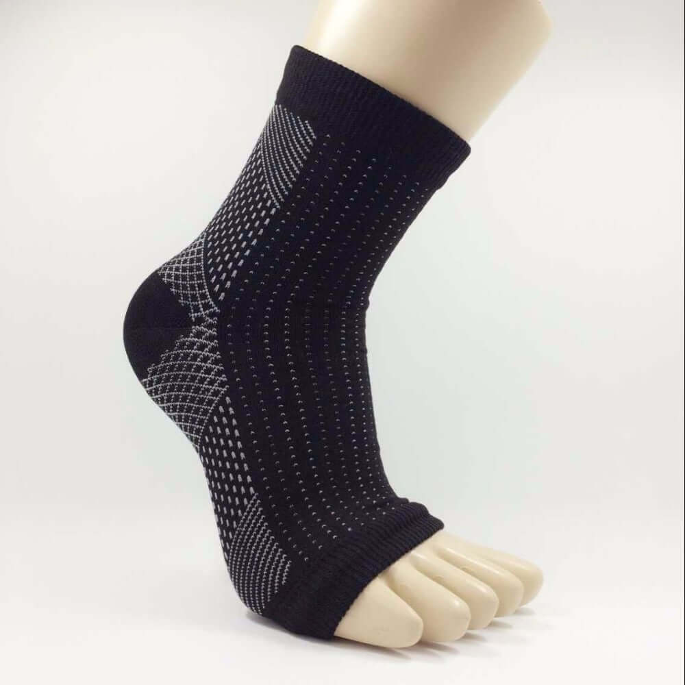 A pair of Anti-Fatigue Compression Socks designed for improved circulation and swelling relief, featuring a breathable fabric and targeted compression zones.