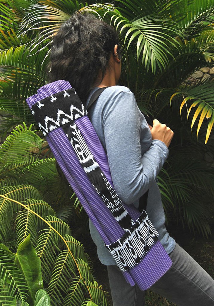 Backstrap Yoga Mat Sling in black and white tribal design, handwoven by Guatemalan artisans, showcasing intricate patterns and Velcro closure.