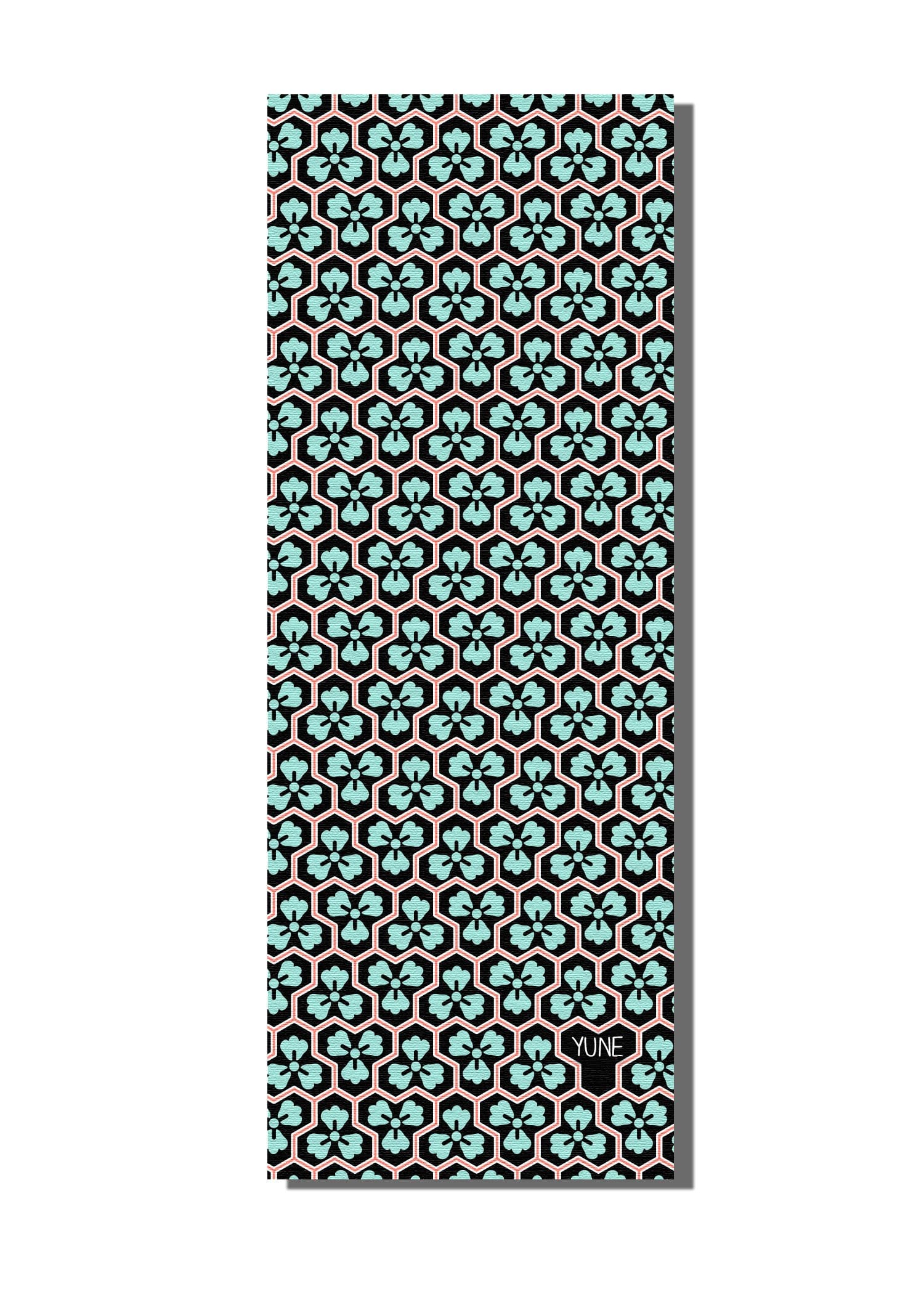 Crow Trekk Travel Yoga Mat in vibrant colors, showcasing its textured surface and lightweight design, ideal for yoga enthusiasts.