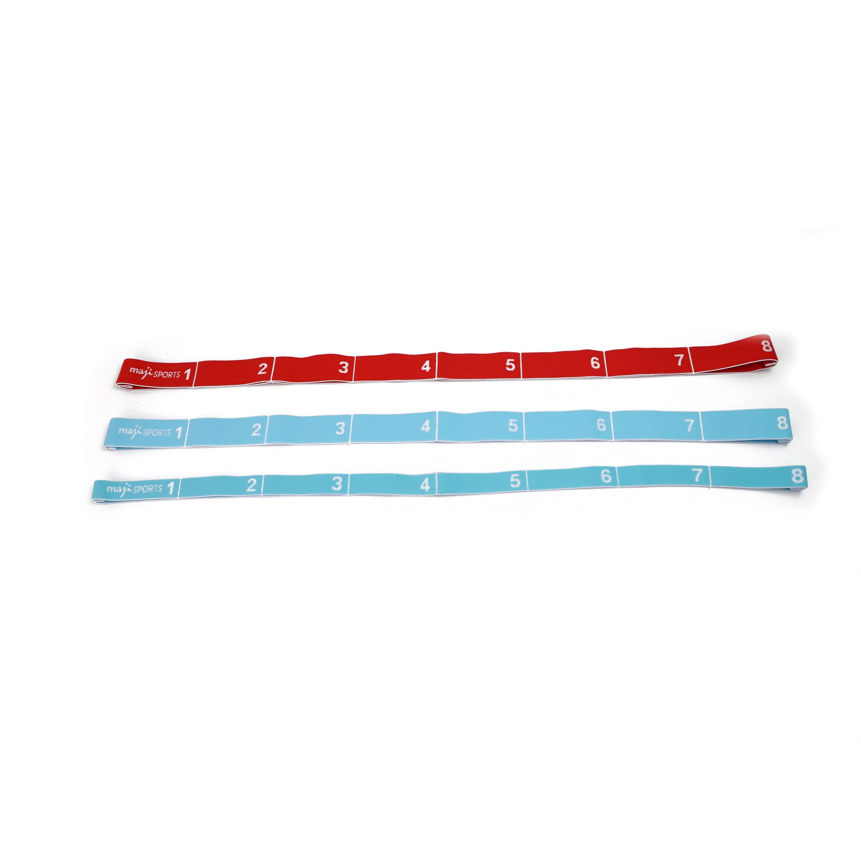 Set of three elastic yoga straps in different colors, designed for flexibility and stability during yoga and Pilates exercises.