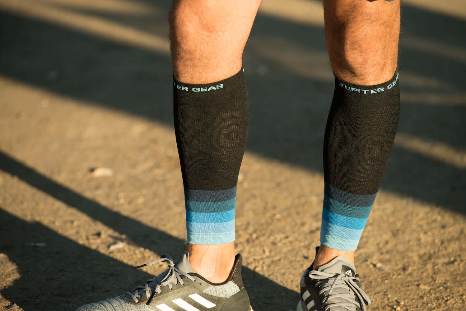 Endurance Compression Calf & Leg Sleeve designed for running and hiking, featuring gradient zoned compression panels for optimal support.