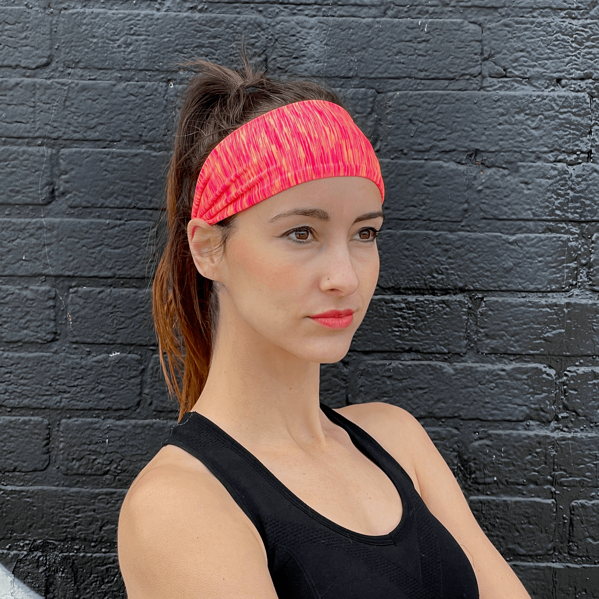 Extra-wide sport and fitness sweat-wicking headband in black, made from nylon-spandex blend, designed for comfort and performance during workouts.