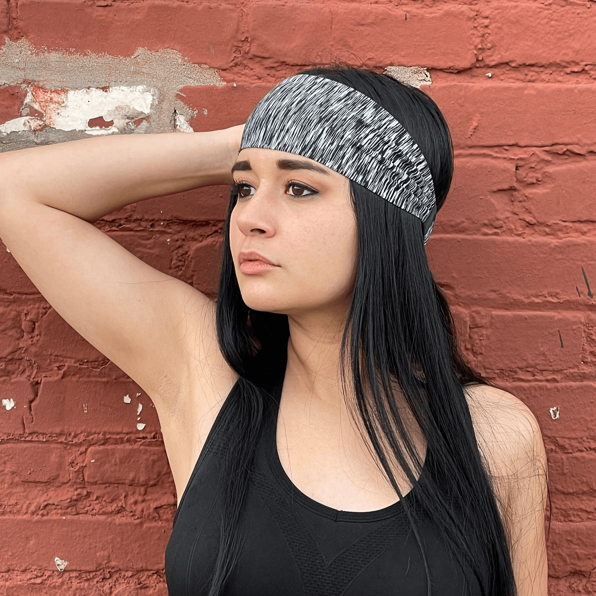 Extra-wide sport and fitness sweat-wicking headband in black, made from nylon-spandex blend, designed for comfort and performance during workouts.