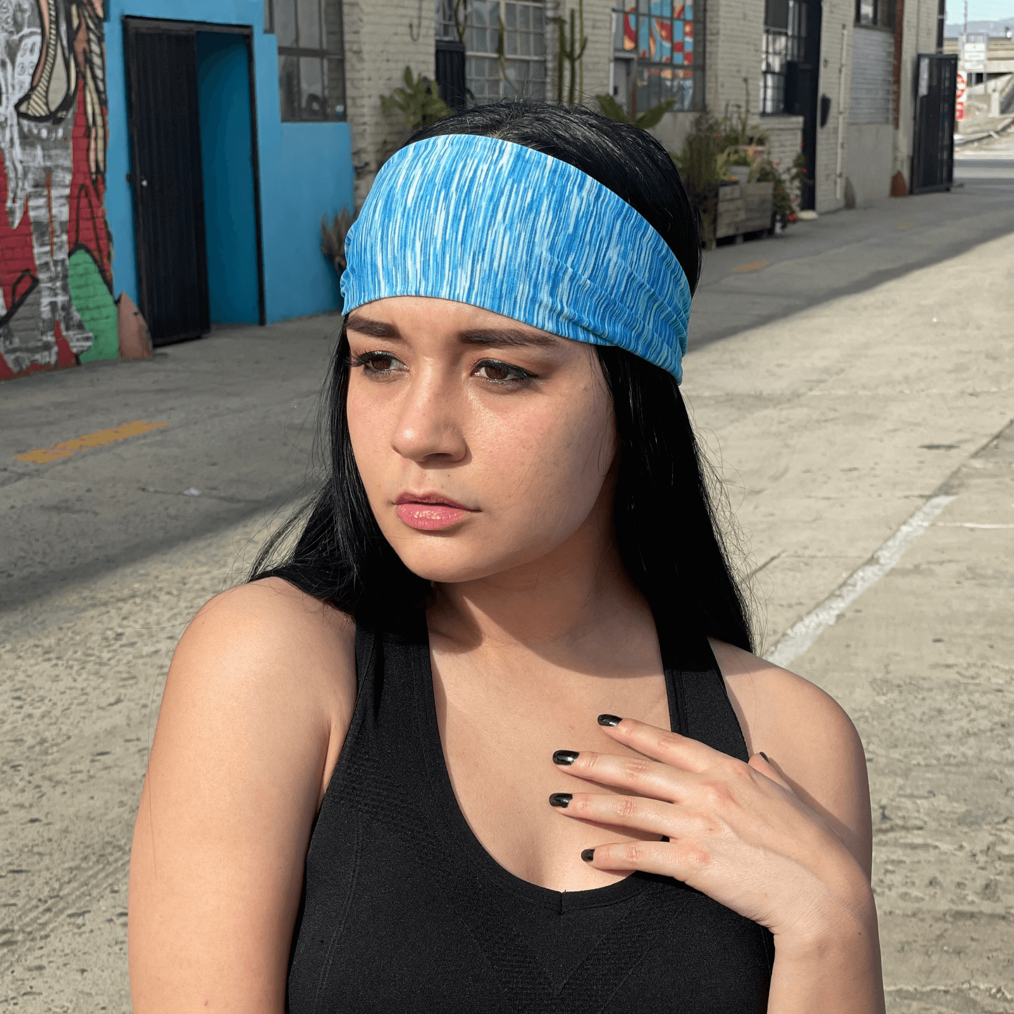 Extra-wide sport and fitness sweat-wicking headband in black, made from nylon-spandex blend, designed for comfort and performance during workouts.