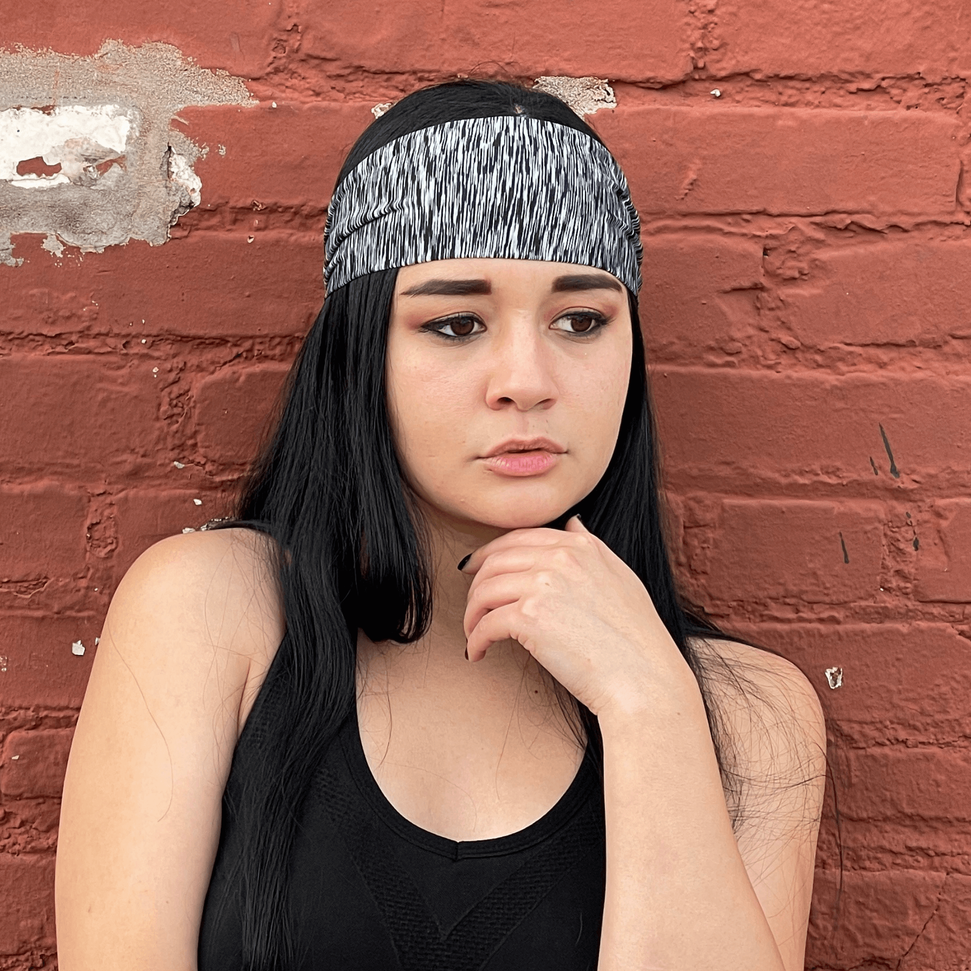 Extra-wide sport and fitness sweat-wicking headband in black, made from nylon-spandex blend, designed for comfort and performance during workouts.