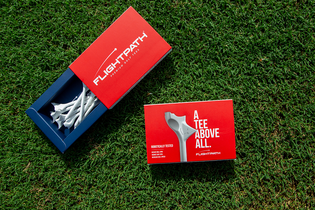 A pack of FlightPath Golf Tees showcasing their unique directional design and durability, ideal for enhancing golf performance.