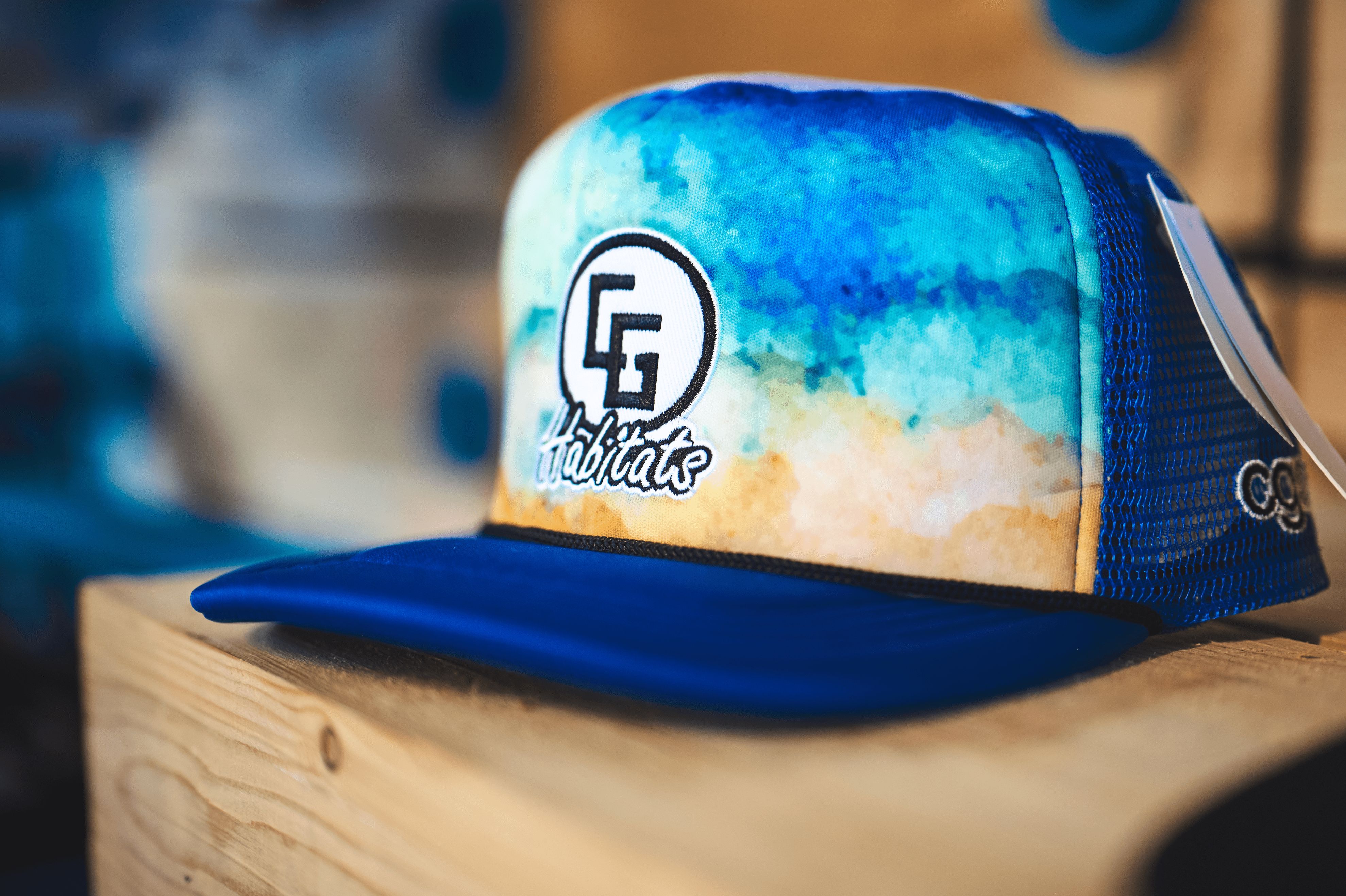 Stylish Foam Trucker Hat_CG featuring a mesh and poly blend, terrycloth sweatband, deep fit, and luxurious 3-D embroidery with an iron-on patch.